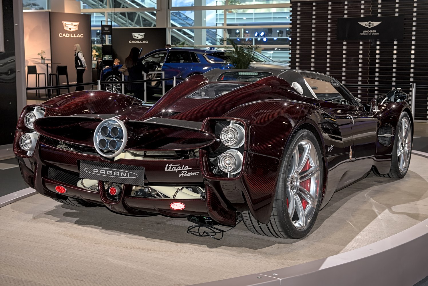 Rear and side view of a hypercar with distinctive quad exhaust and aerodynamic body.
