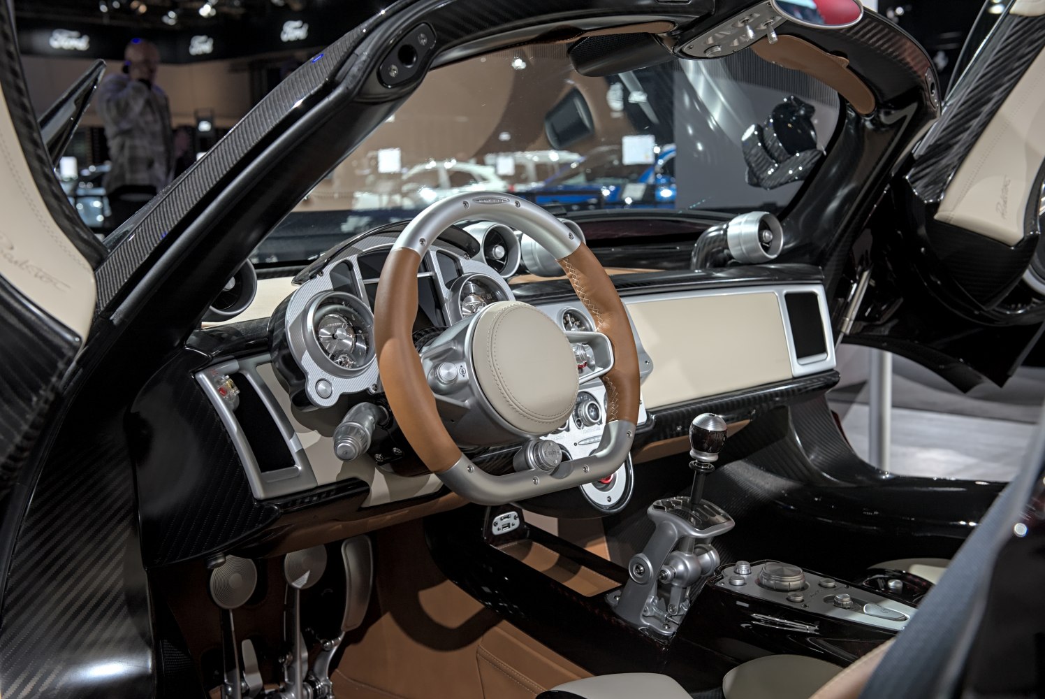 Luxury sports car interior with stylish steering wheel and manual gear shifter