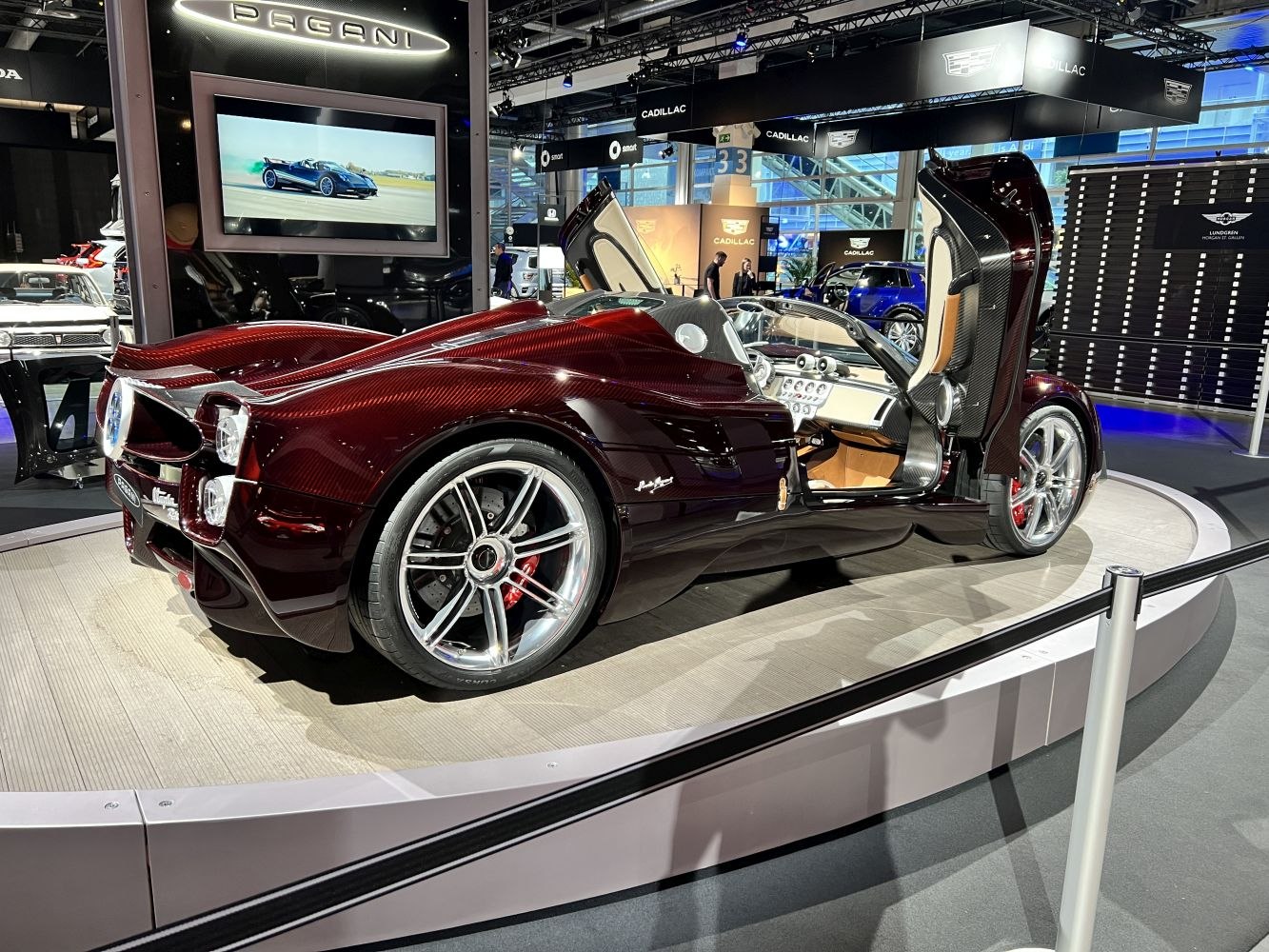 Rear view of luxury sports convertible with butterfly doors and carbon fiber body