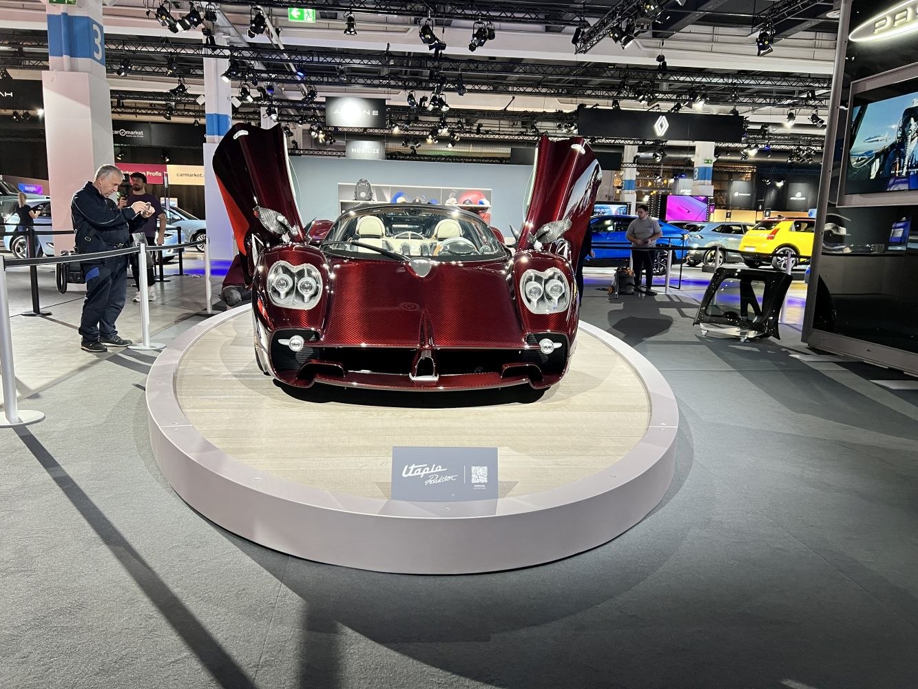 Front view of a luxury roadster with distinctive gullwing doors.