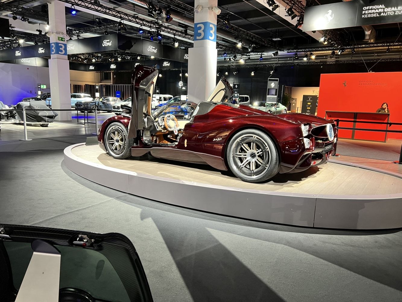 Butterfly doors and carbon fiber body of a sleek roadster on display