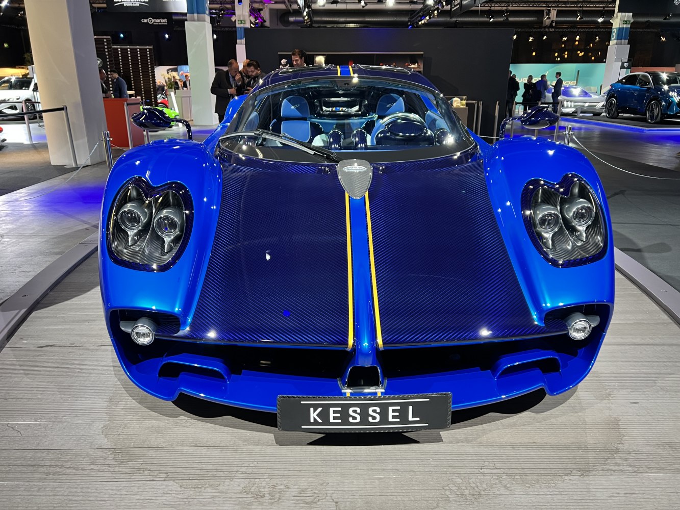 Front view with carbon fiber hood and quad headlights in vibrant blue
