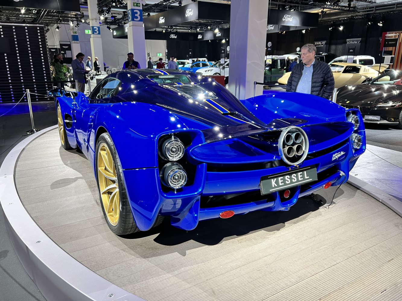 Vivid blue rear with quad exhaust and gold rims