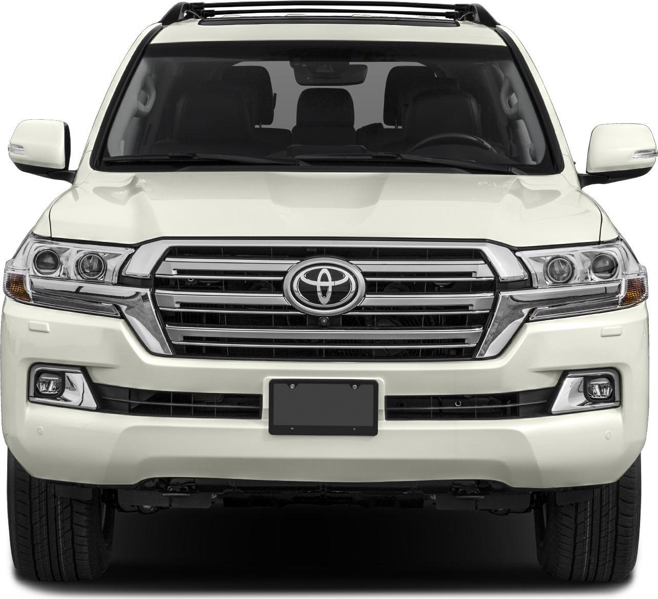 Front view with prominent grille, headlights, and roof rails
