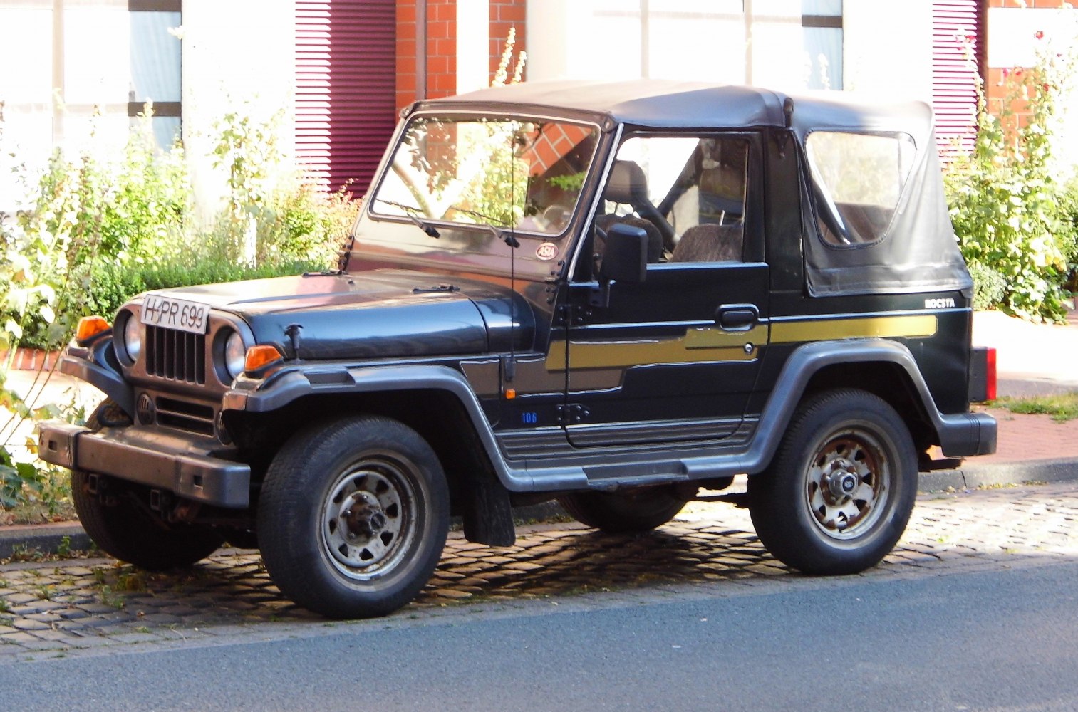 Soft top off-road SUV with rugged compact design.