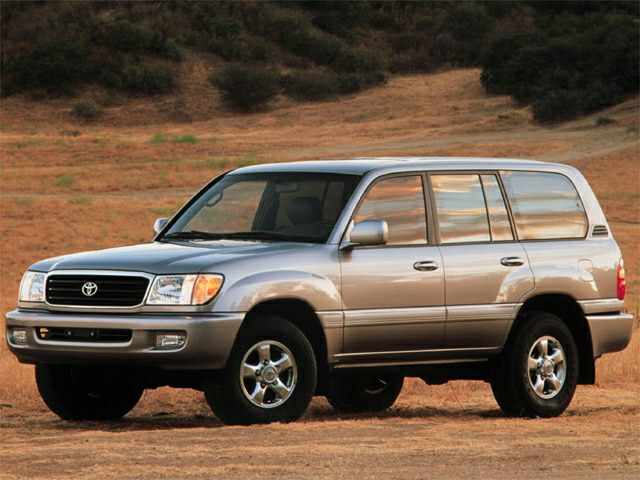 Silver 5-door SUV side front view on rough terrain