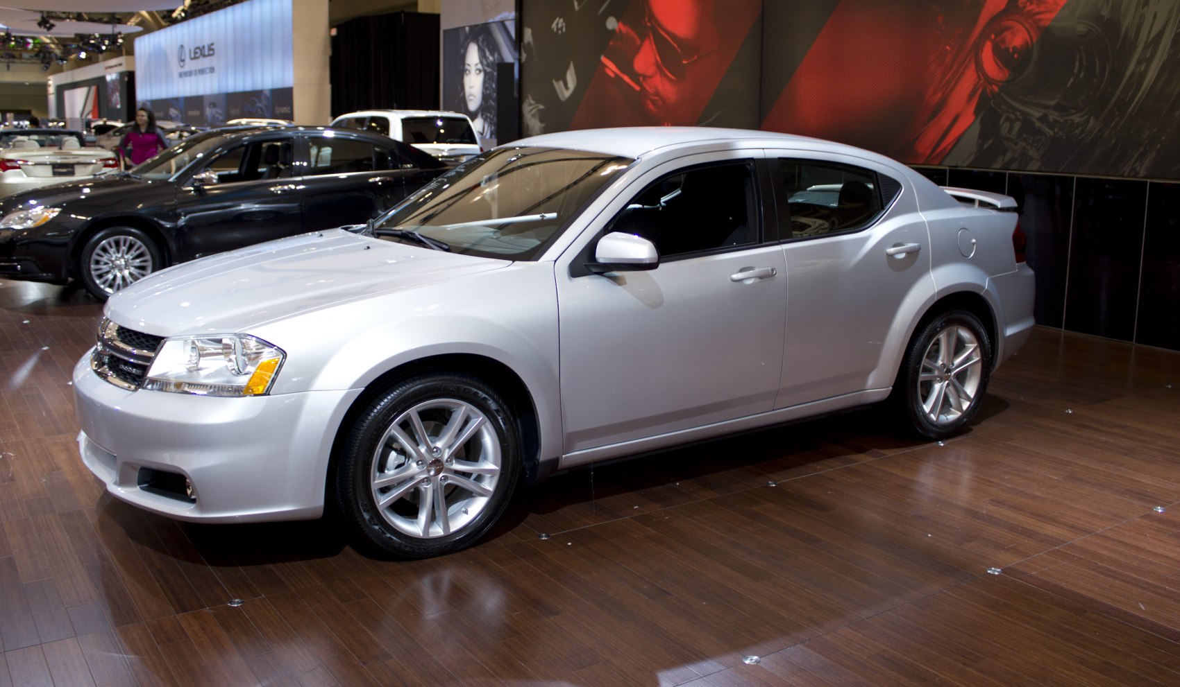 Front three-quarter view of a silver mid-size sedan with alloy wheels.