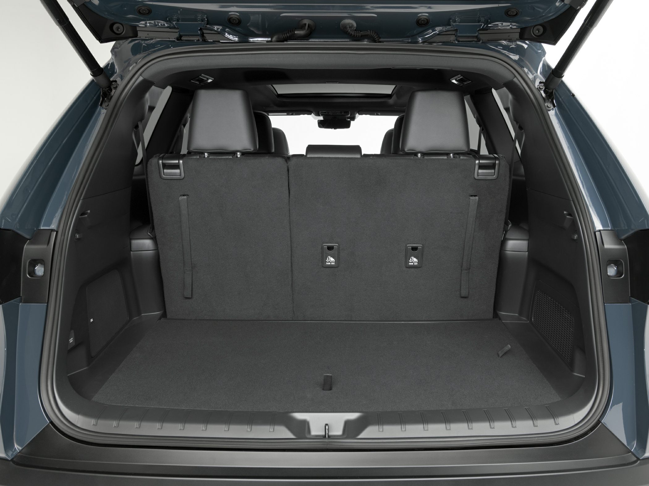 Folded third-row seats creating spacious rear cargo area.