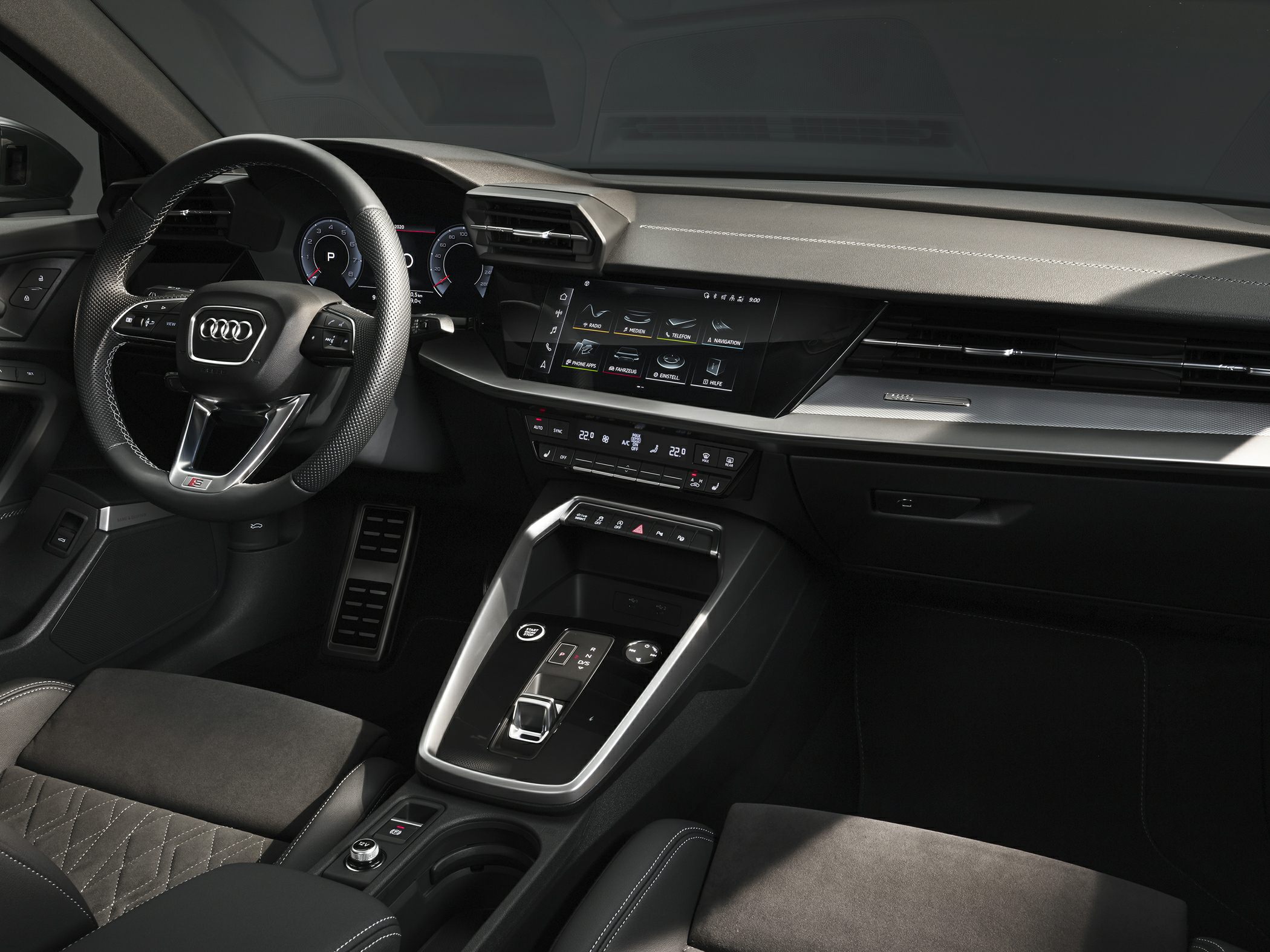 Digital instrument cluster and touchscreen infotainment with sporty steering wheel