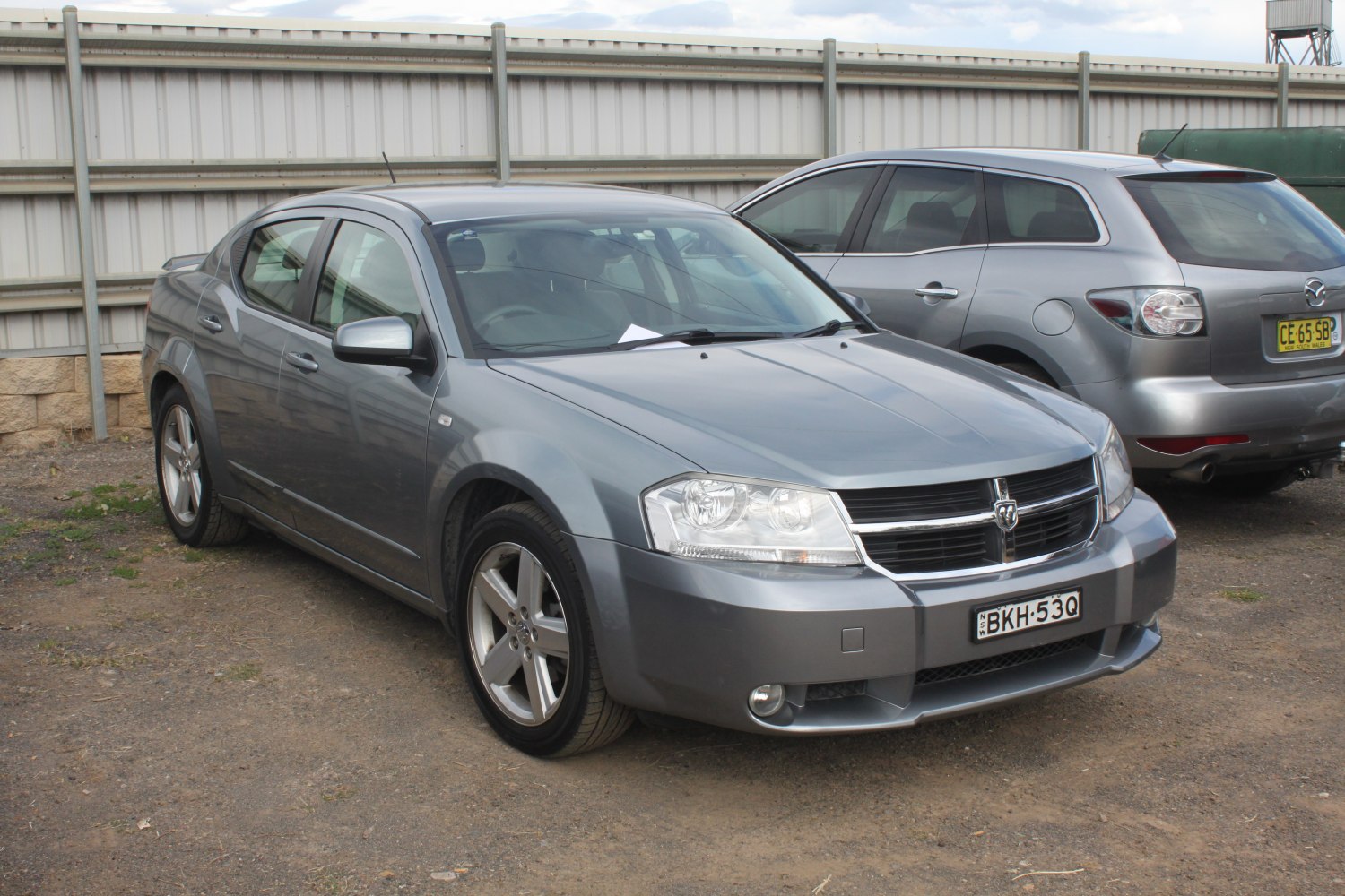 Gray sedan with distinctive grille and alloy wheels front side view