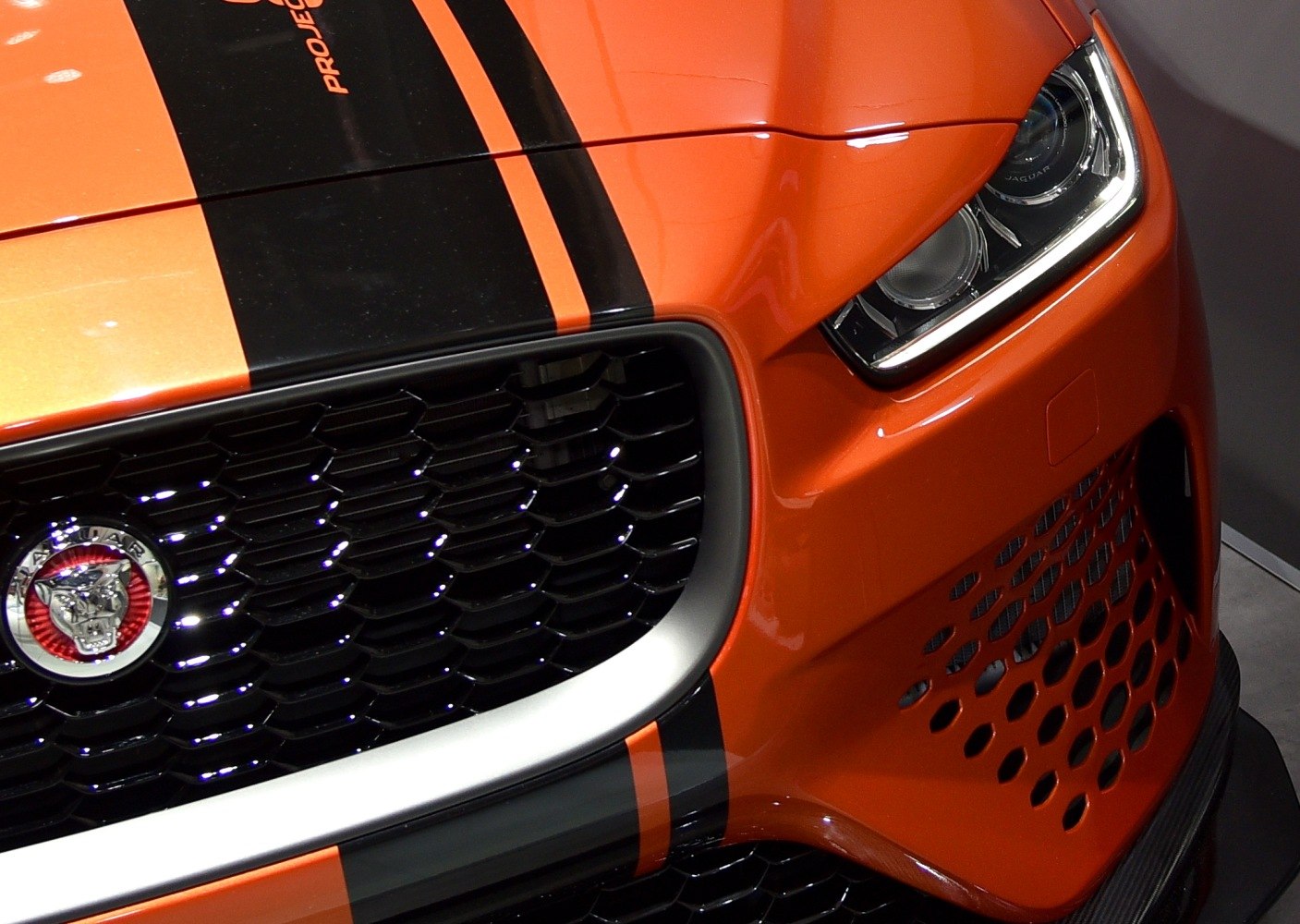 Honeycomb grille, LED headlight, and orange-black hood stripes
