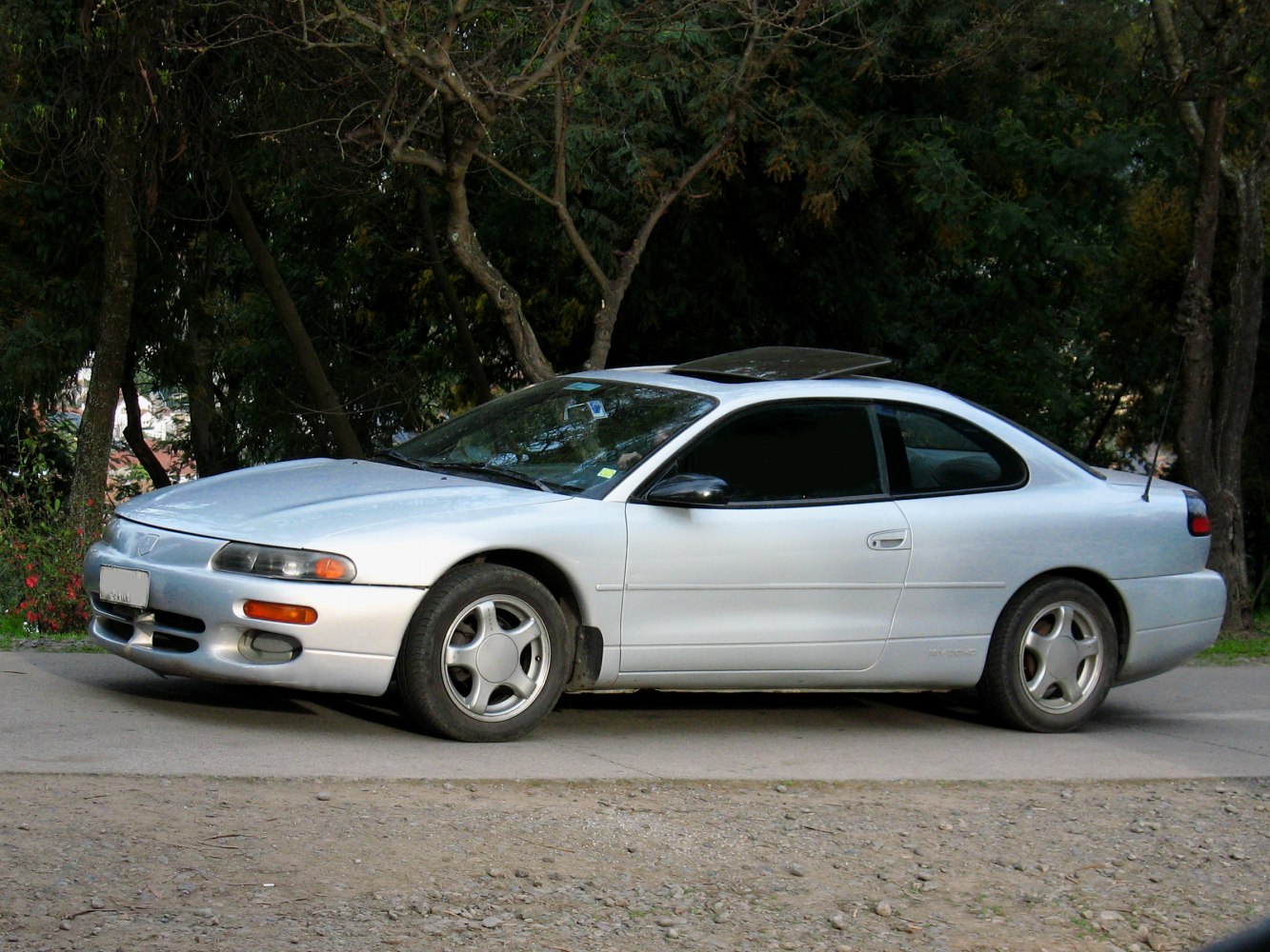 Silver 2-door coupe with sunroof and alloy wheels