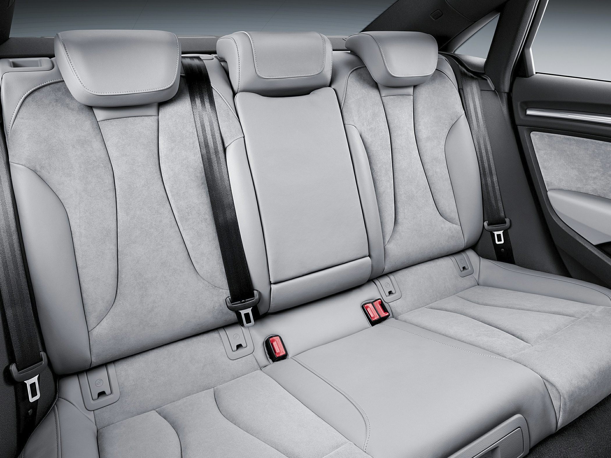 Rear seat upholstery with seat belts and headrests