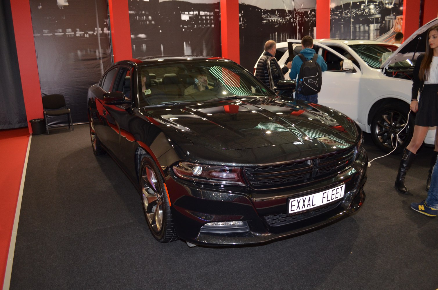Front view with grille and headlight design of black Dodge Charger VII