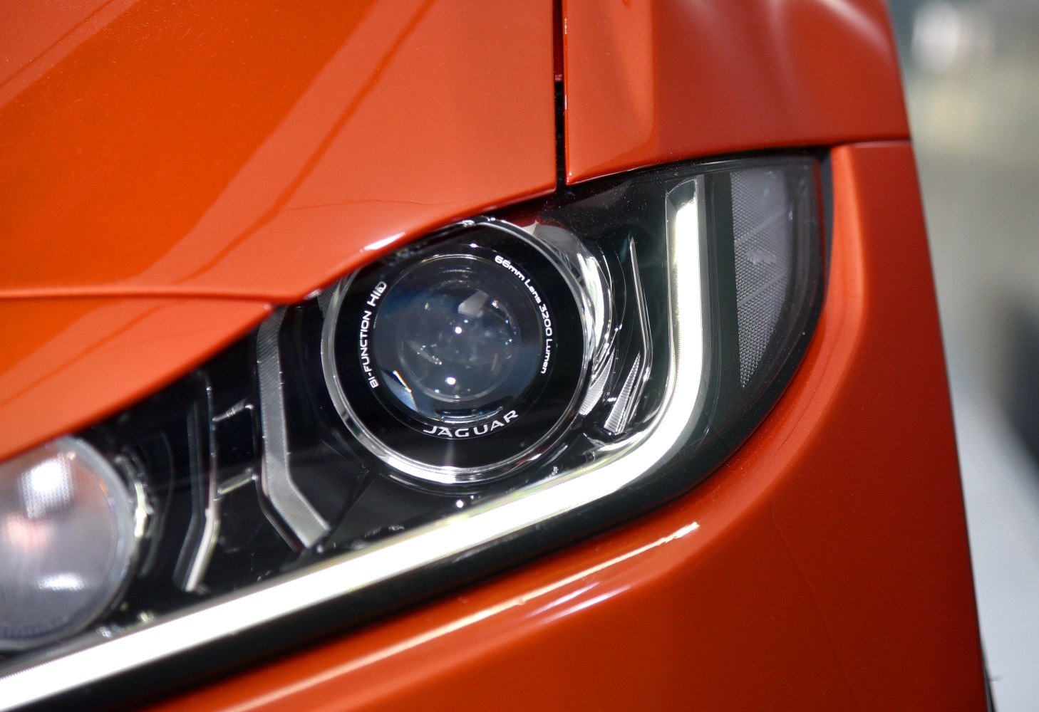 Close-up of bi-function HID projector headlight with LED daytime running light