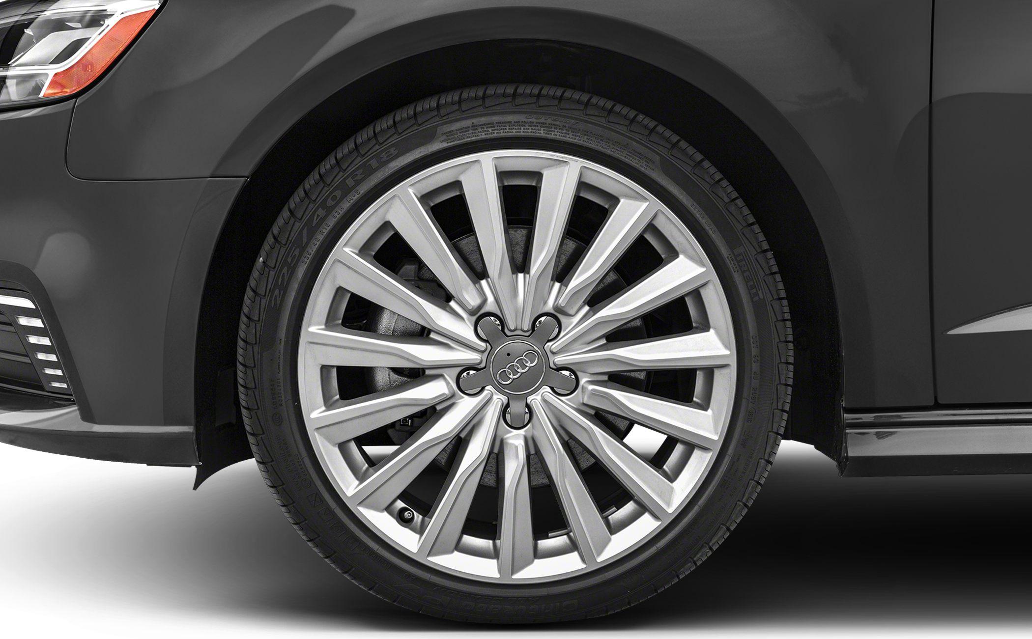 Close-up of intricate multi-spoke alloy wheel with tire.