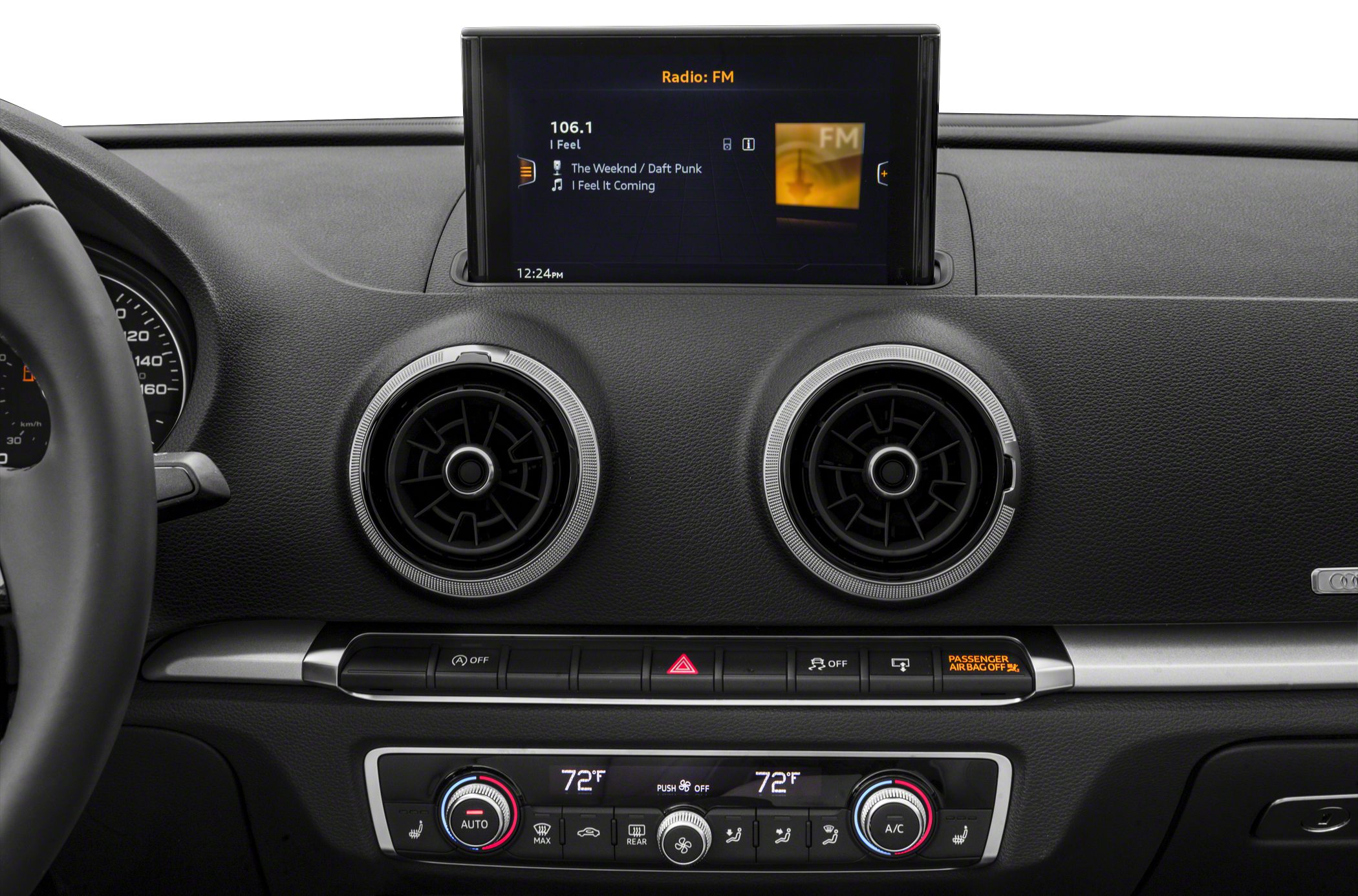 Dual round air vents with infotainment screen and climate controls.