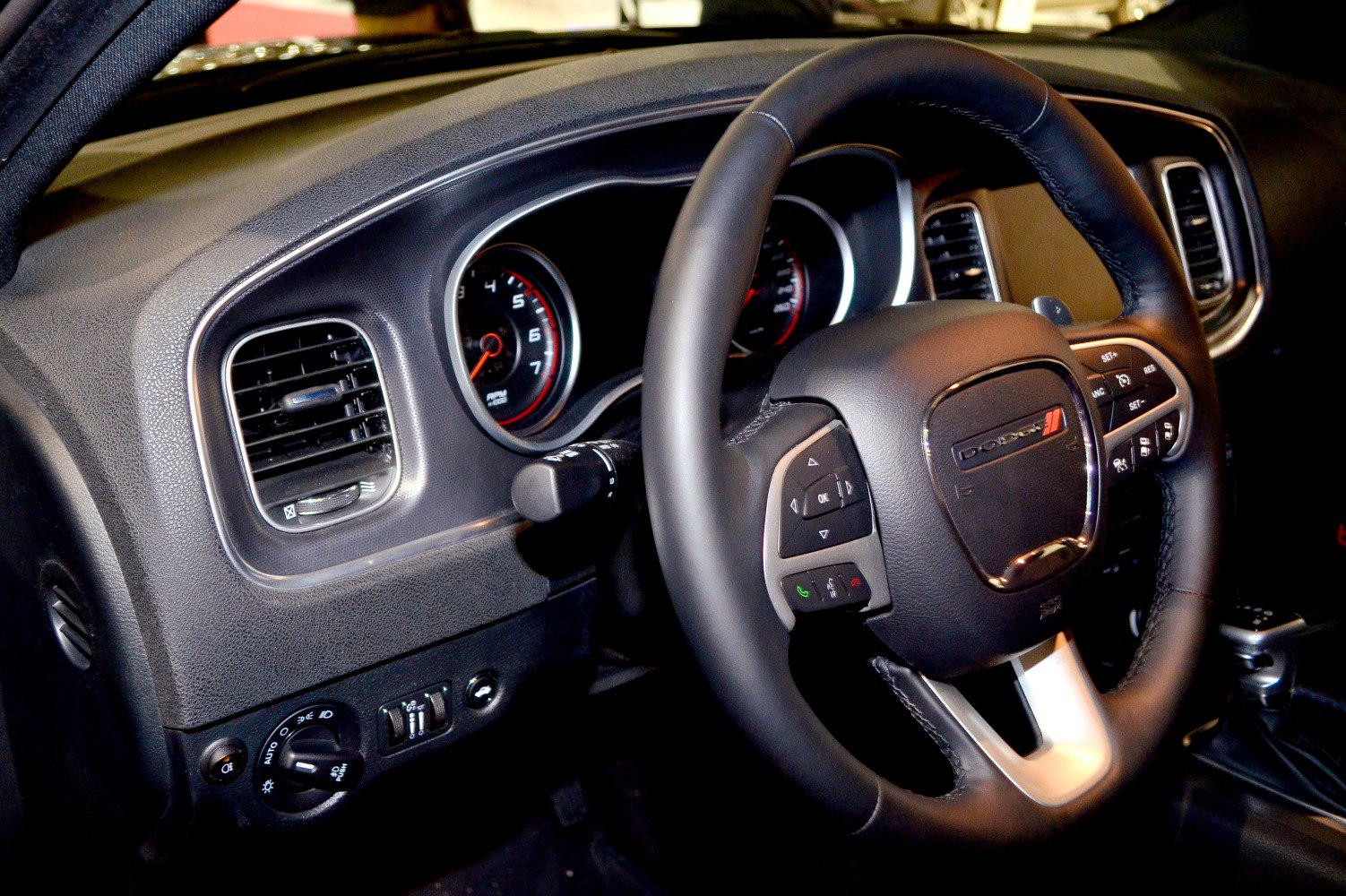 Steering wheel and dashboard close-up with controls