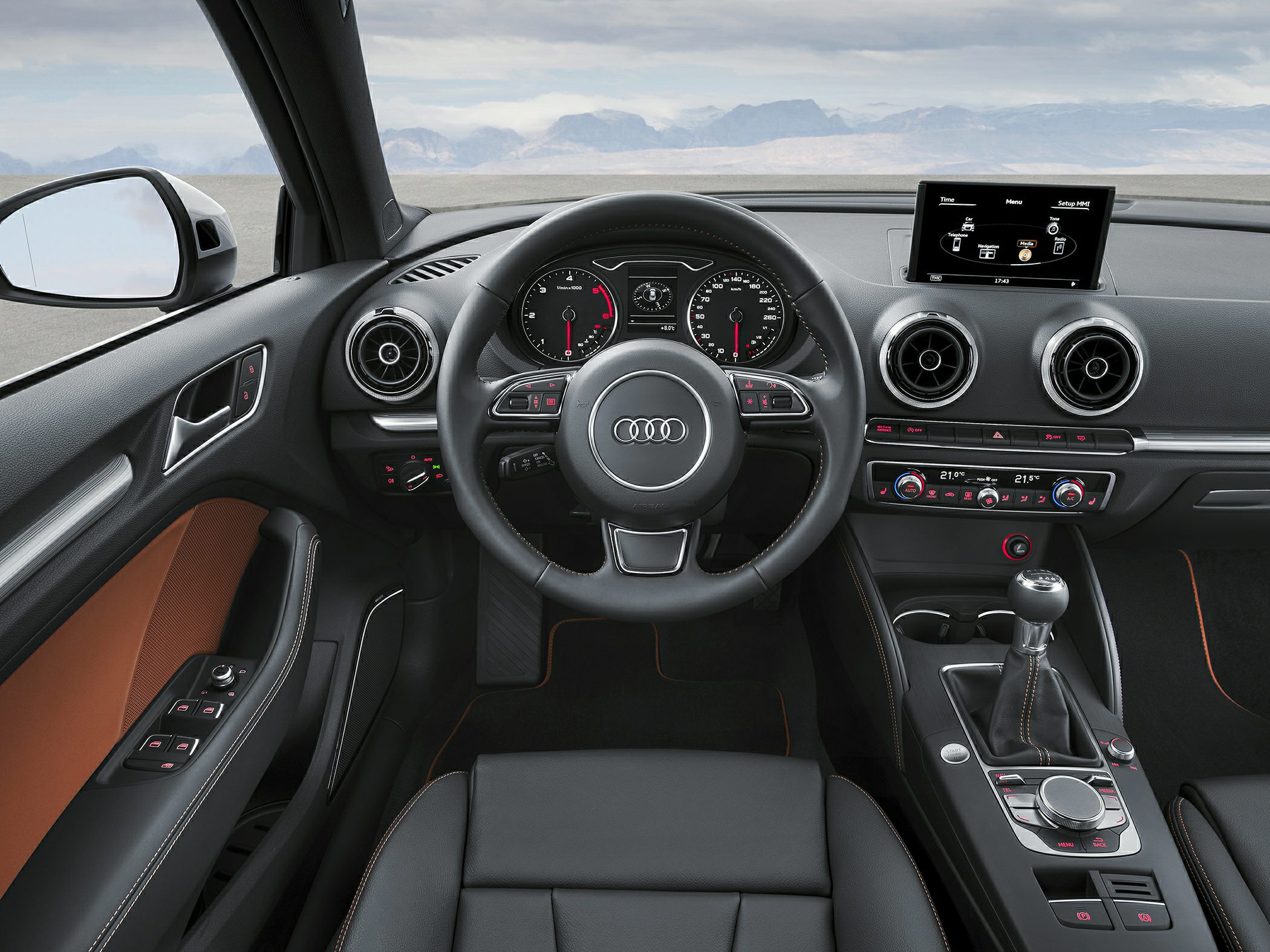 Interior dashboard with steering wheel, gear shift, and digital controls.
