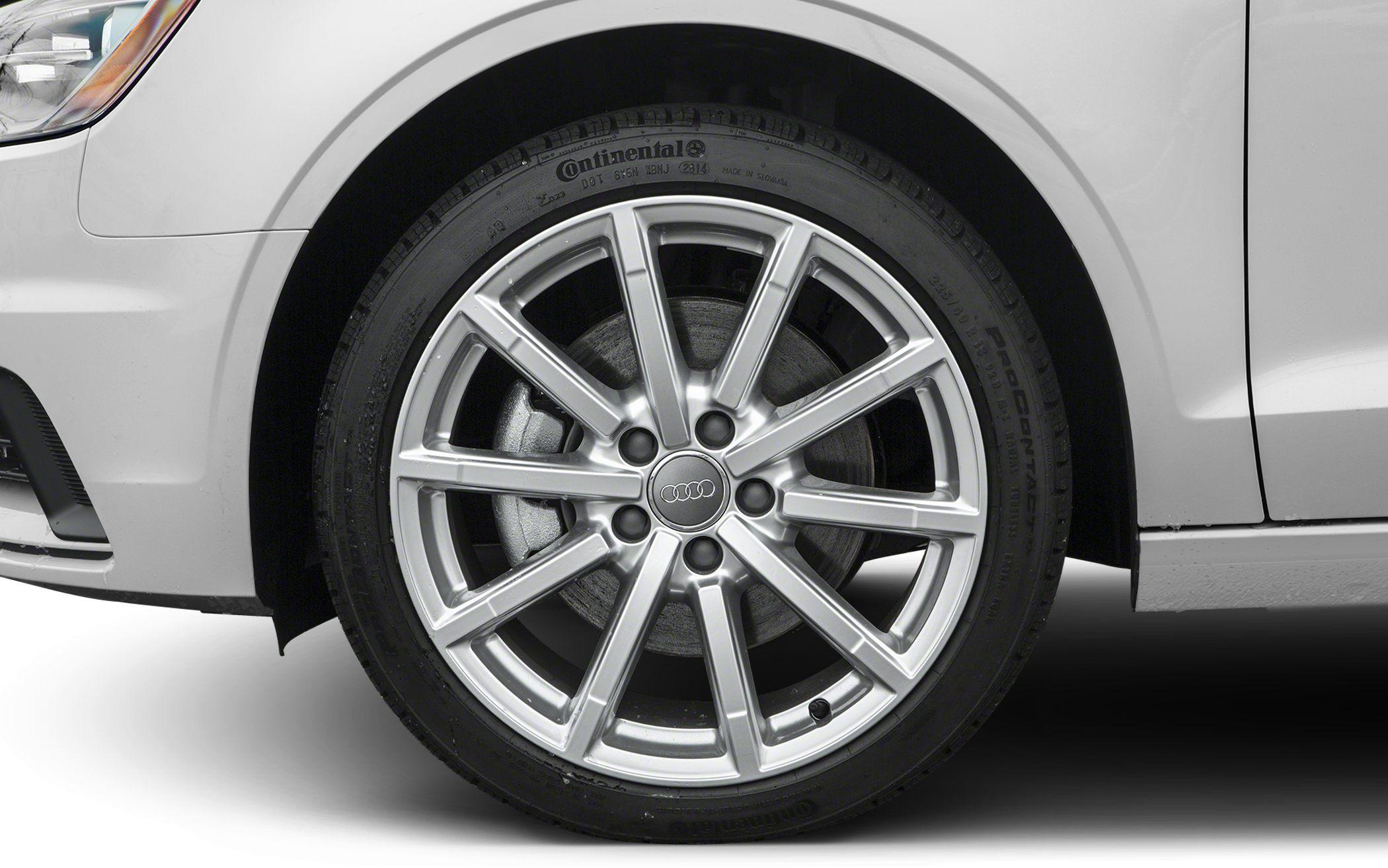 Close-up of silver 10-spoke alloy wheel with Continental tire