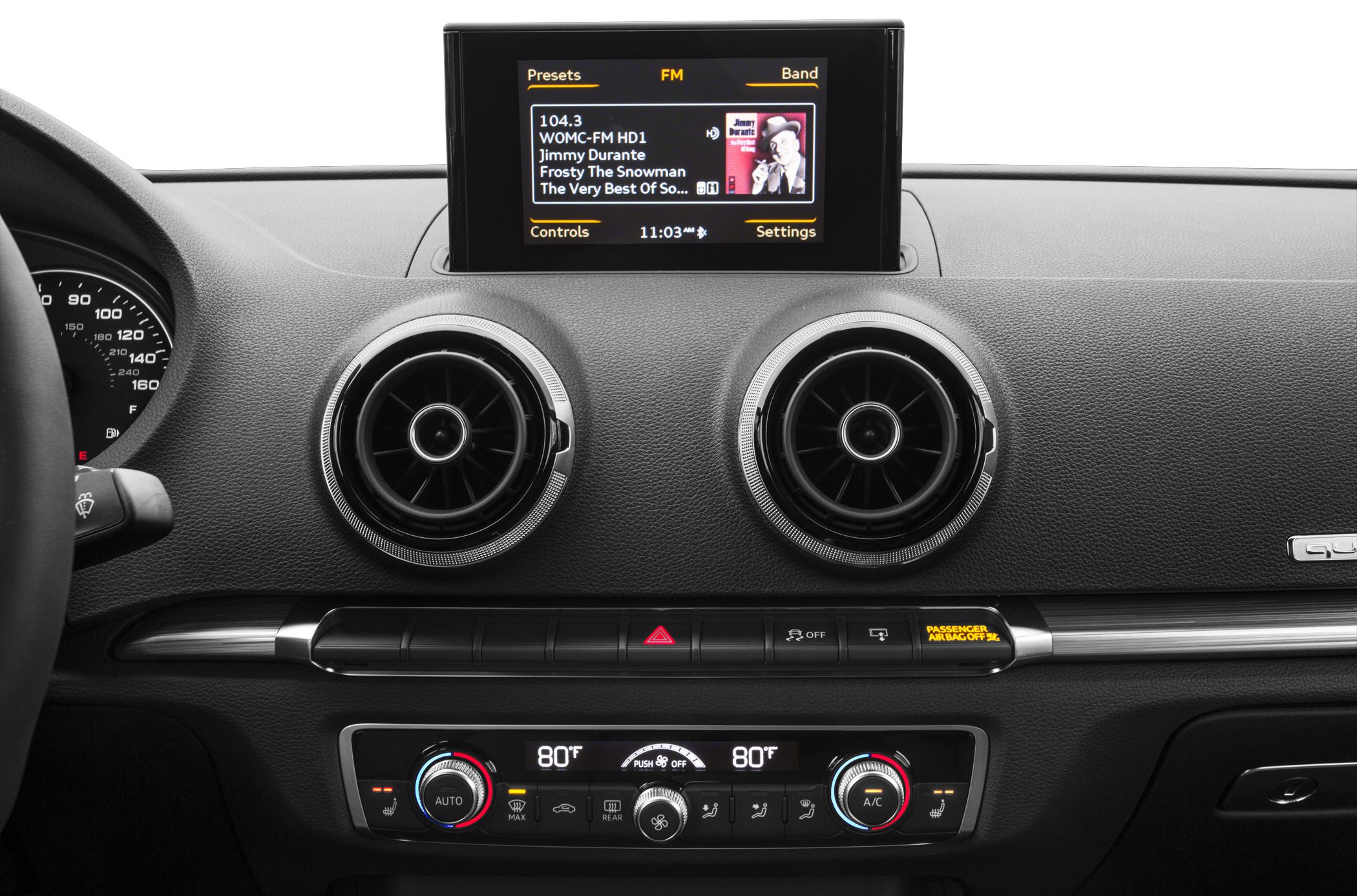 Dual circular air vents, infotainment display, and dual-zone climate control