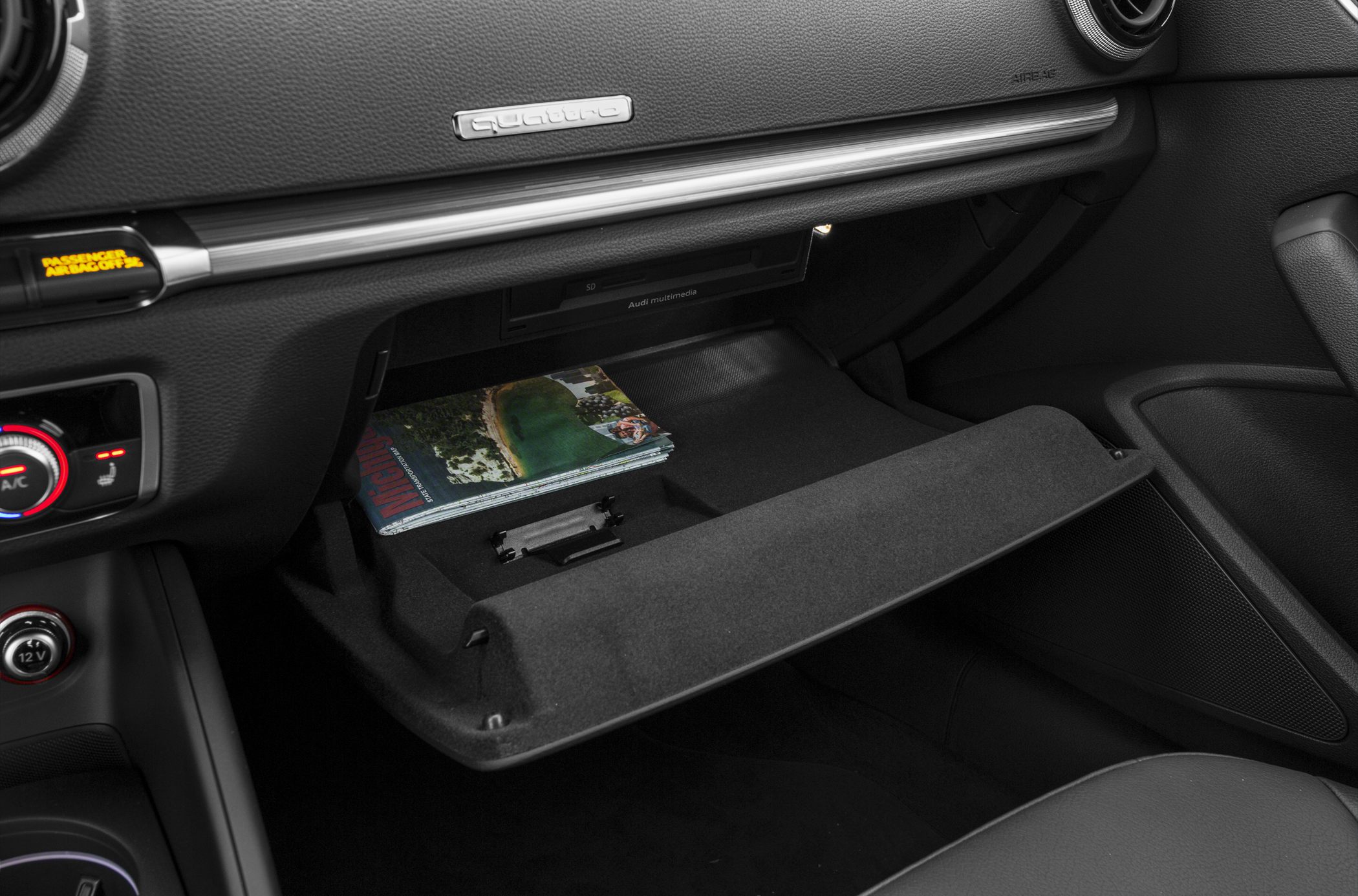 Car glovebox with quattro badge and multimedia compartment