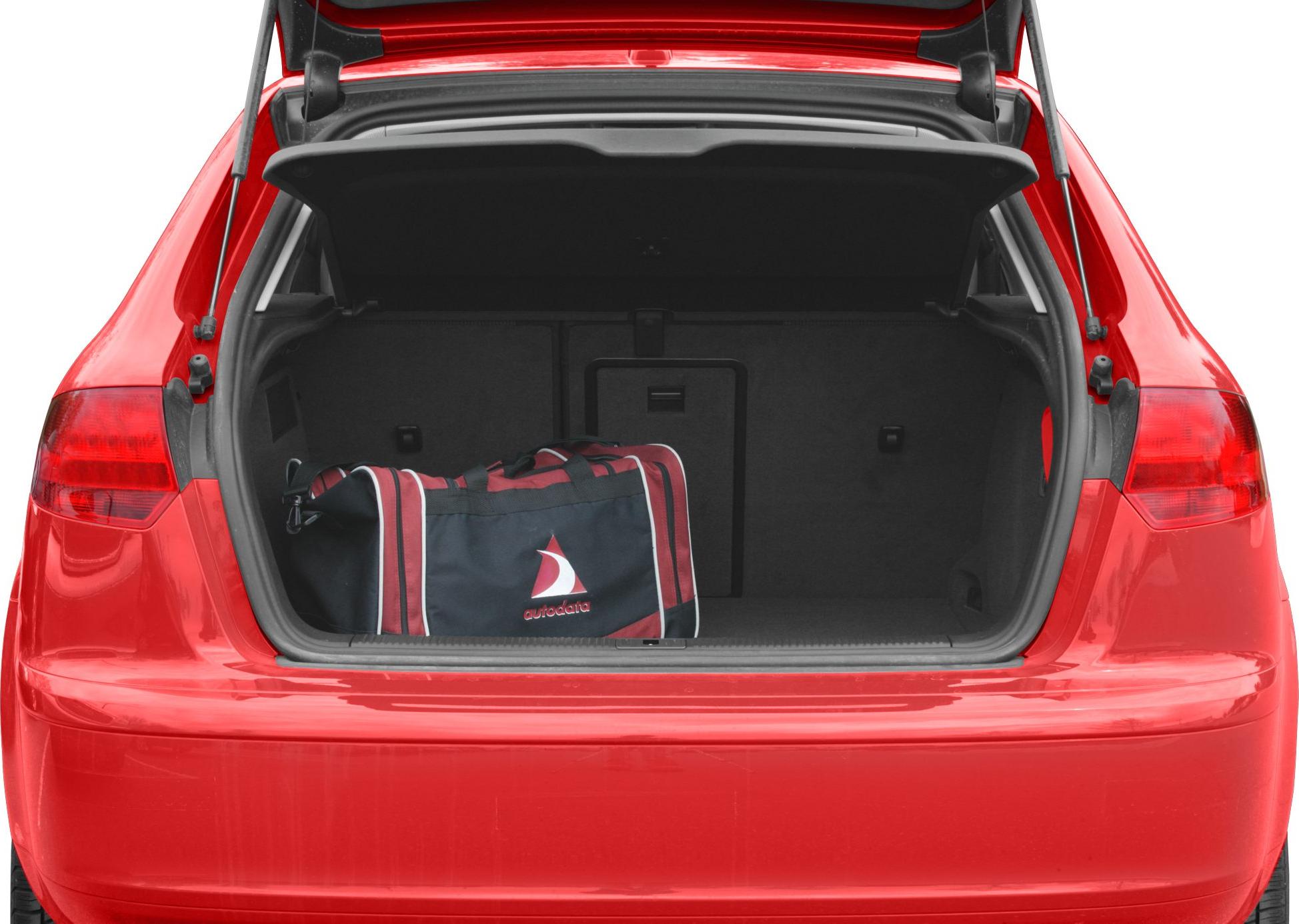 Open rear trunk with sports bag inside.