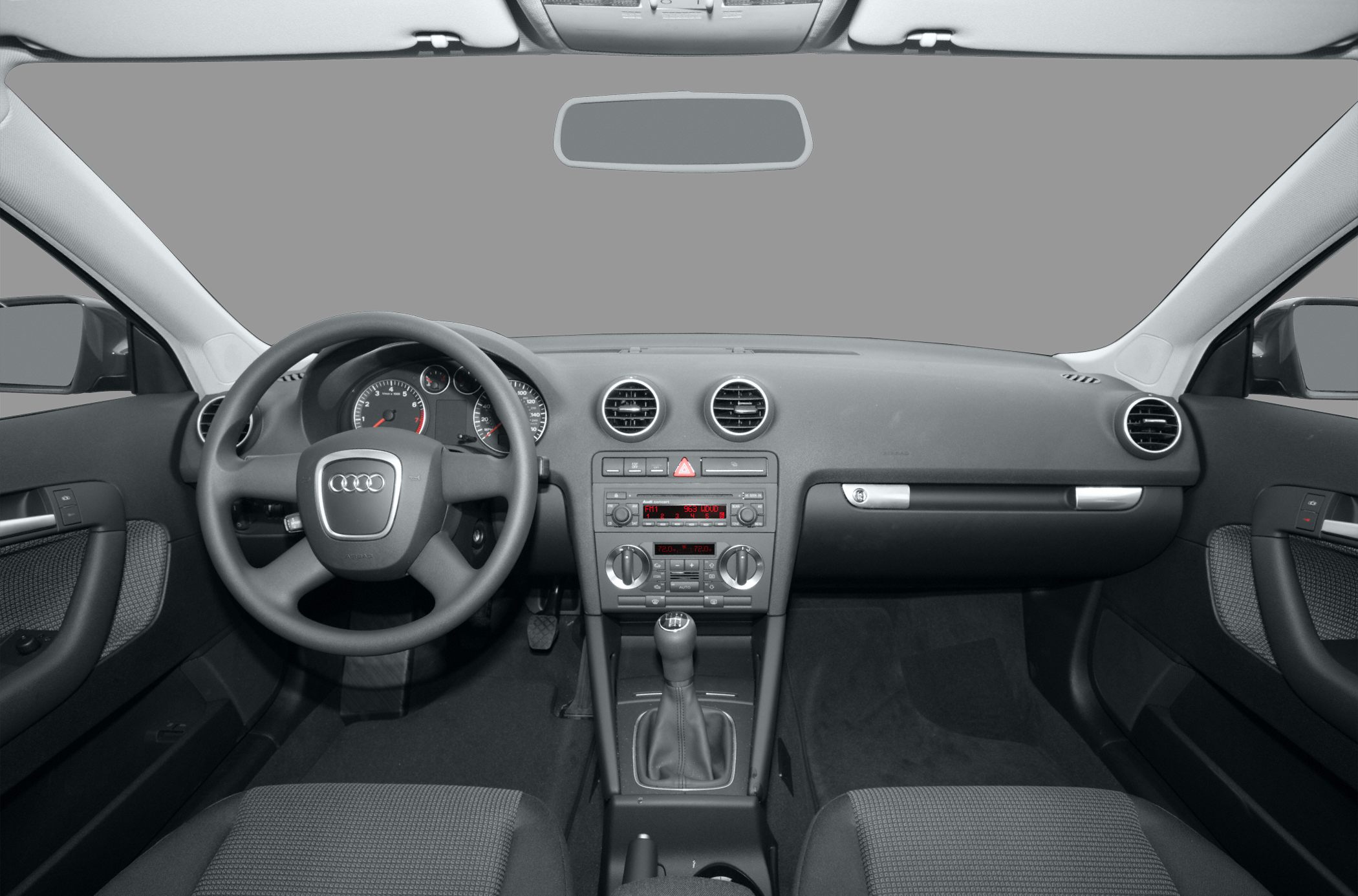Audi interior dashboard with steering wheel and manual gearshift