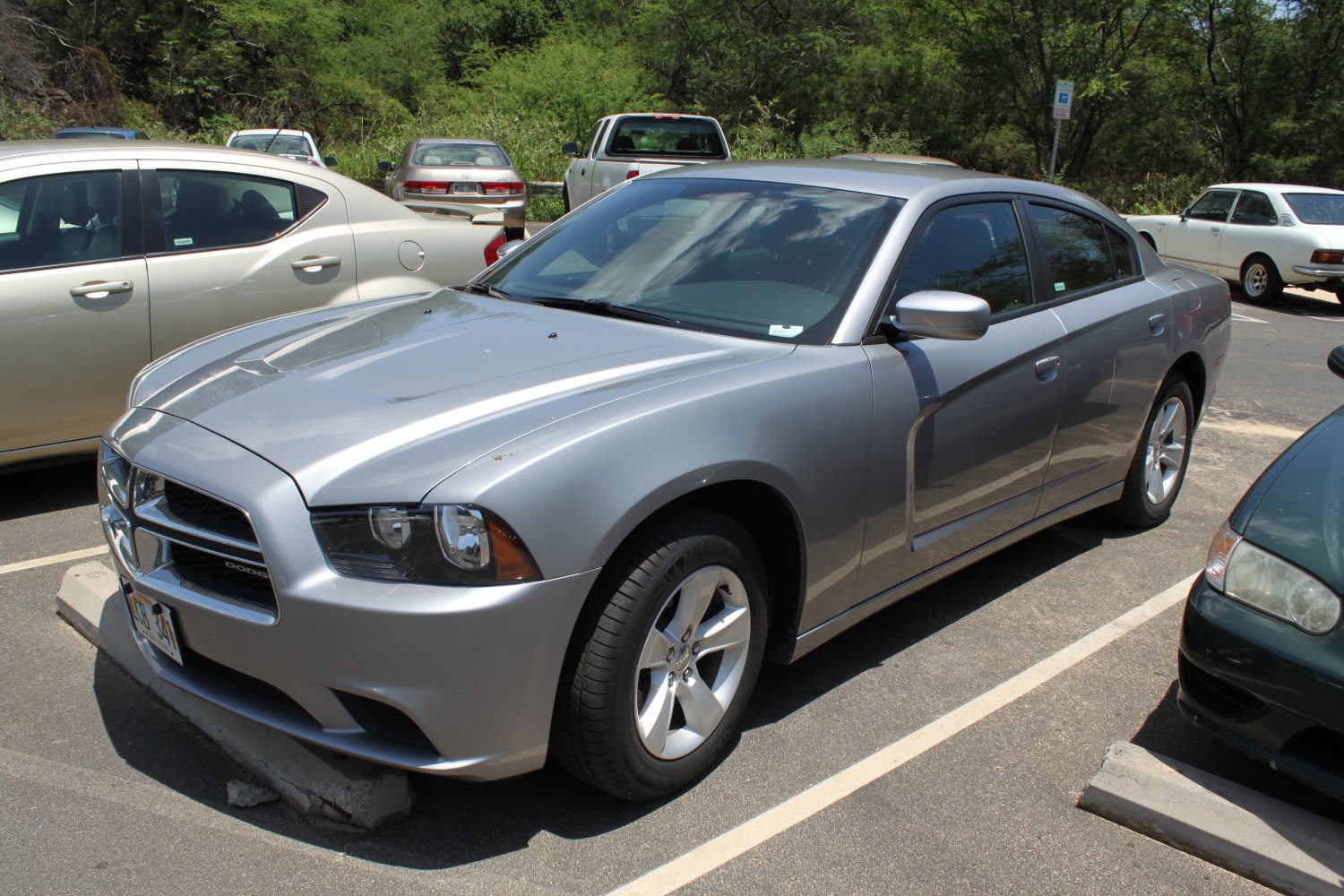 Silver sedan with distinctive front grille and five-spoke alloy wheels