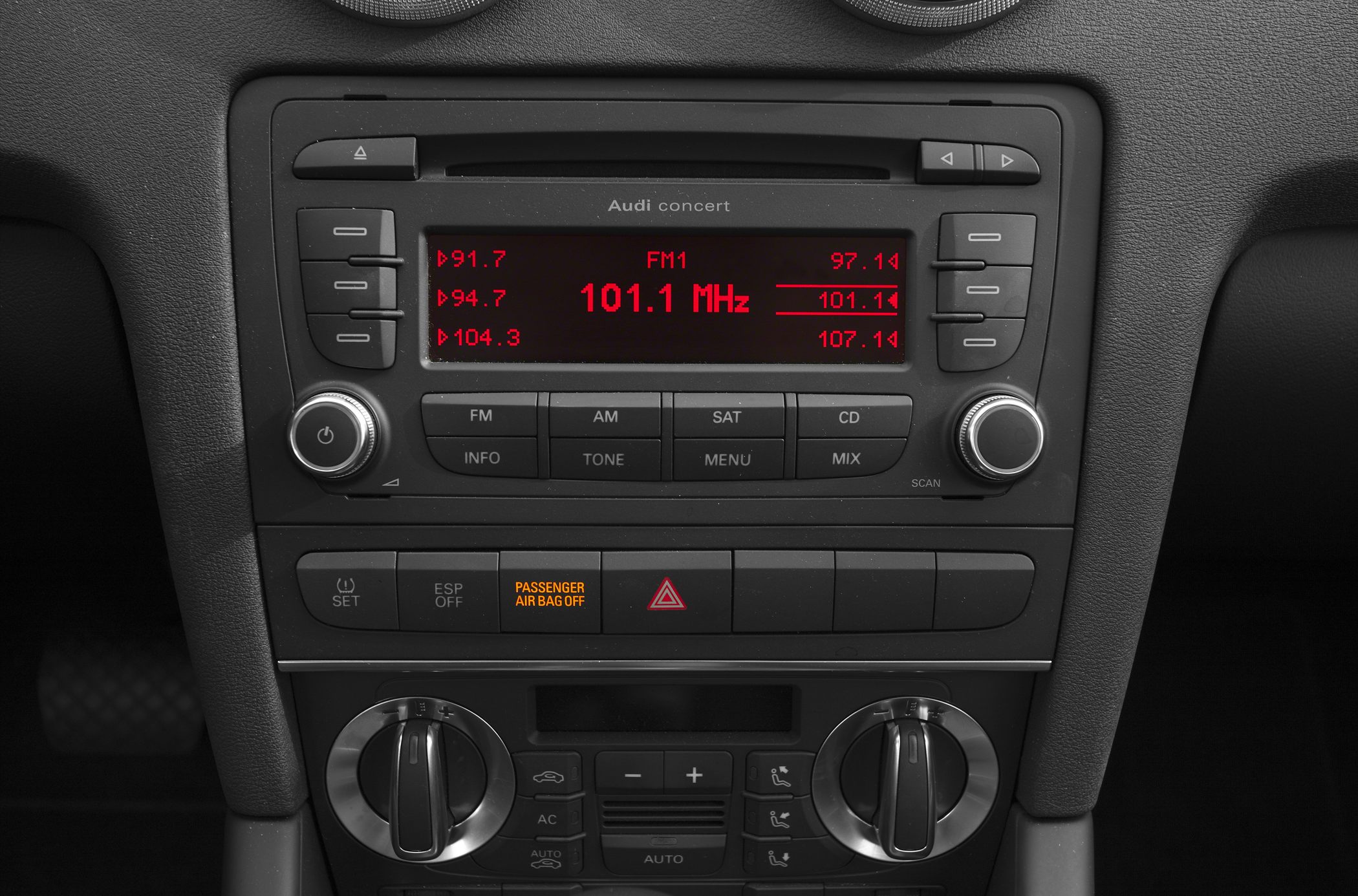 Audi car audio system with climate controls and dashboard buttons