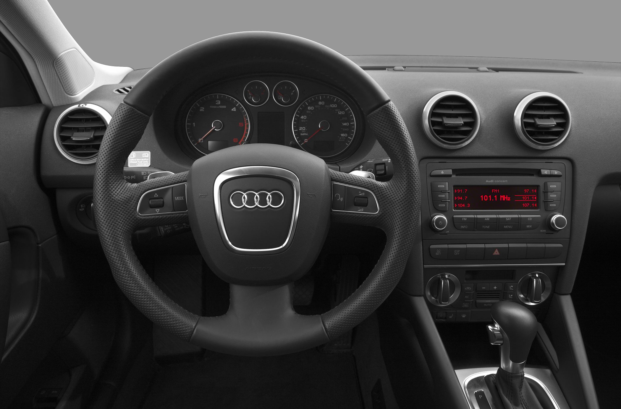 Steering wheel, dashboard, center console with radio and climate controls
