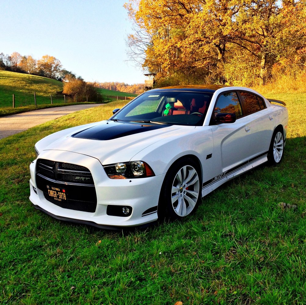 Front-side view with sporty aerodynamic body kit and custom rims