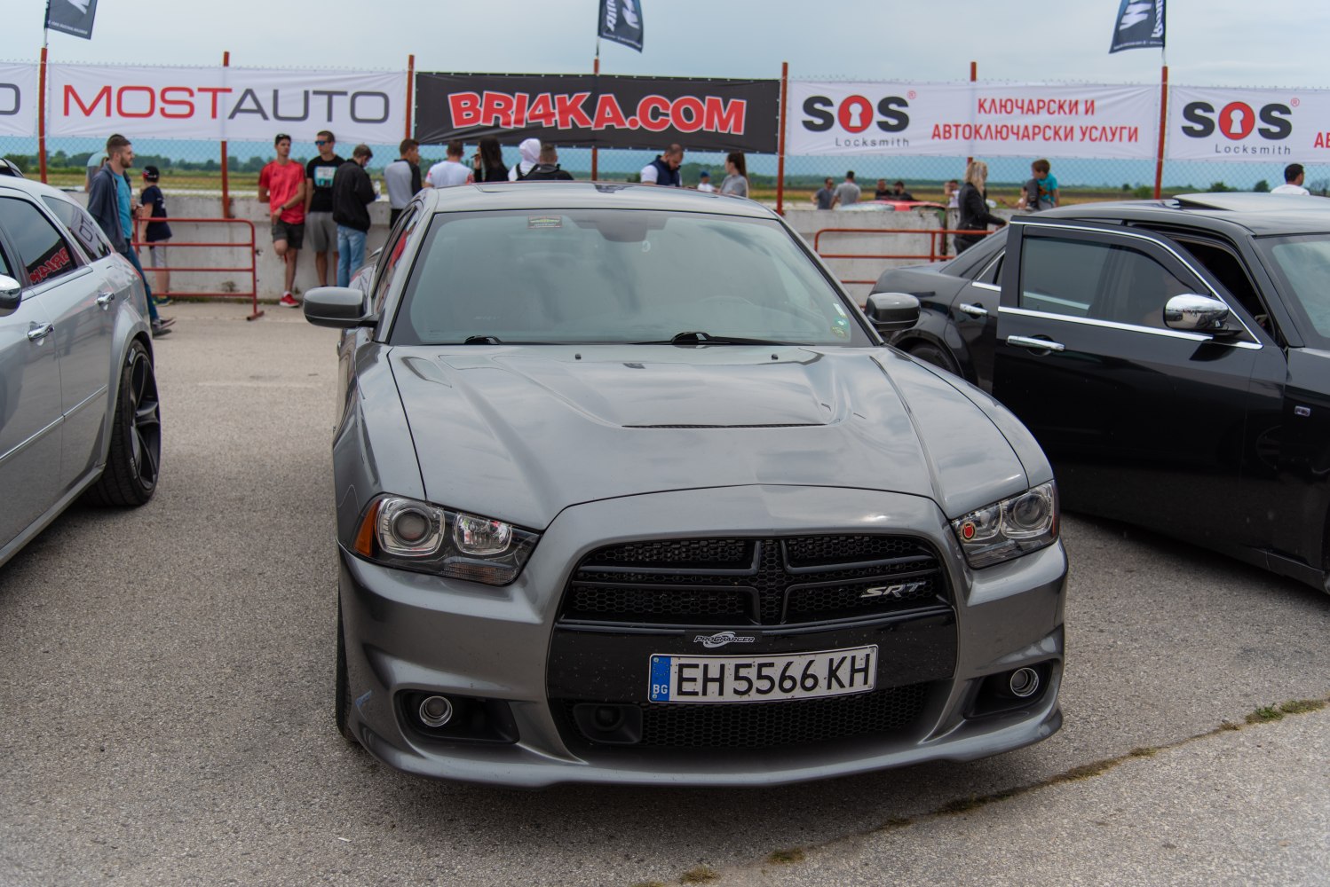 Gray Dodge Charger front view with black grille and hood scoop