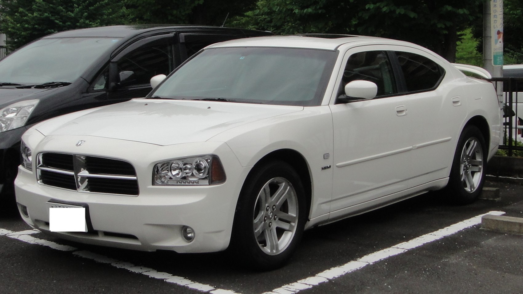 White sedan with distinctive grille and alloy wheels
