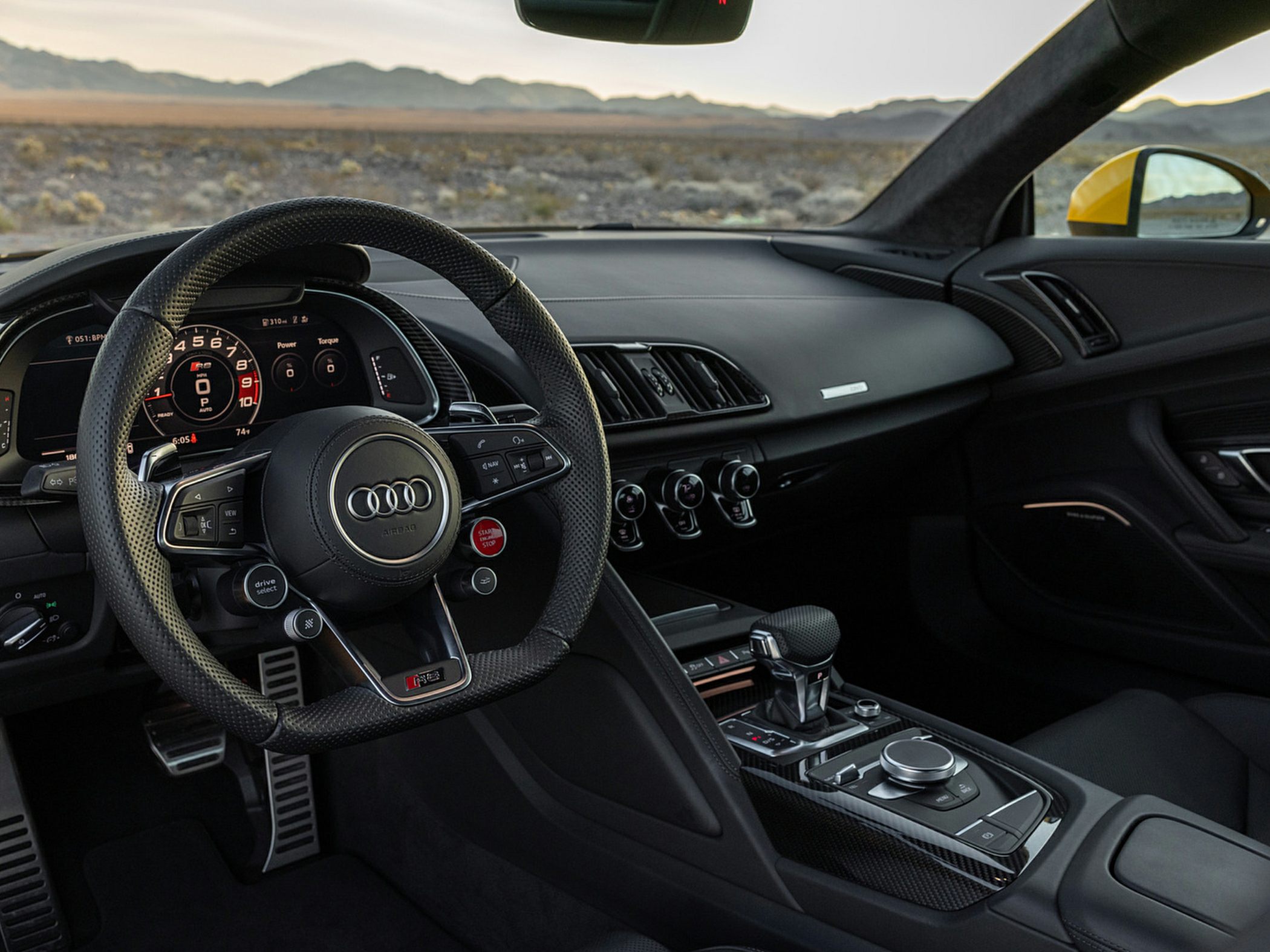 Digital dashboard, steering wheel, center console of a luxury sports coupe
