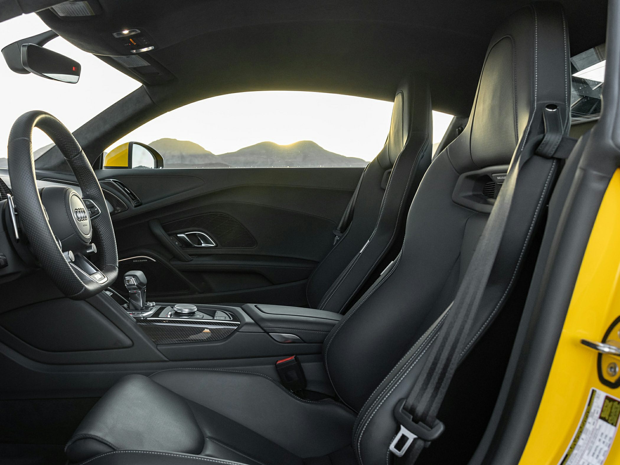 Luxury sports car interior with premium seats and advanced controls