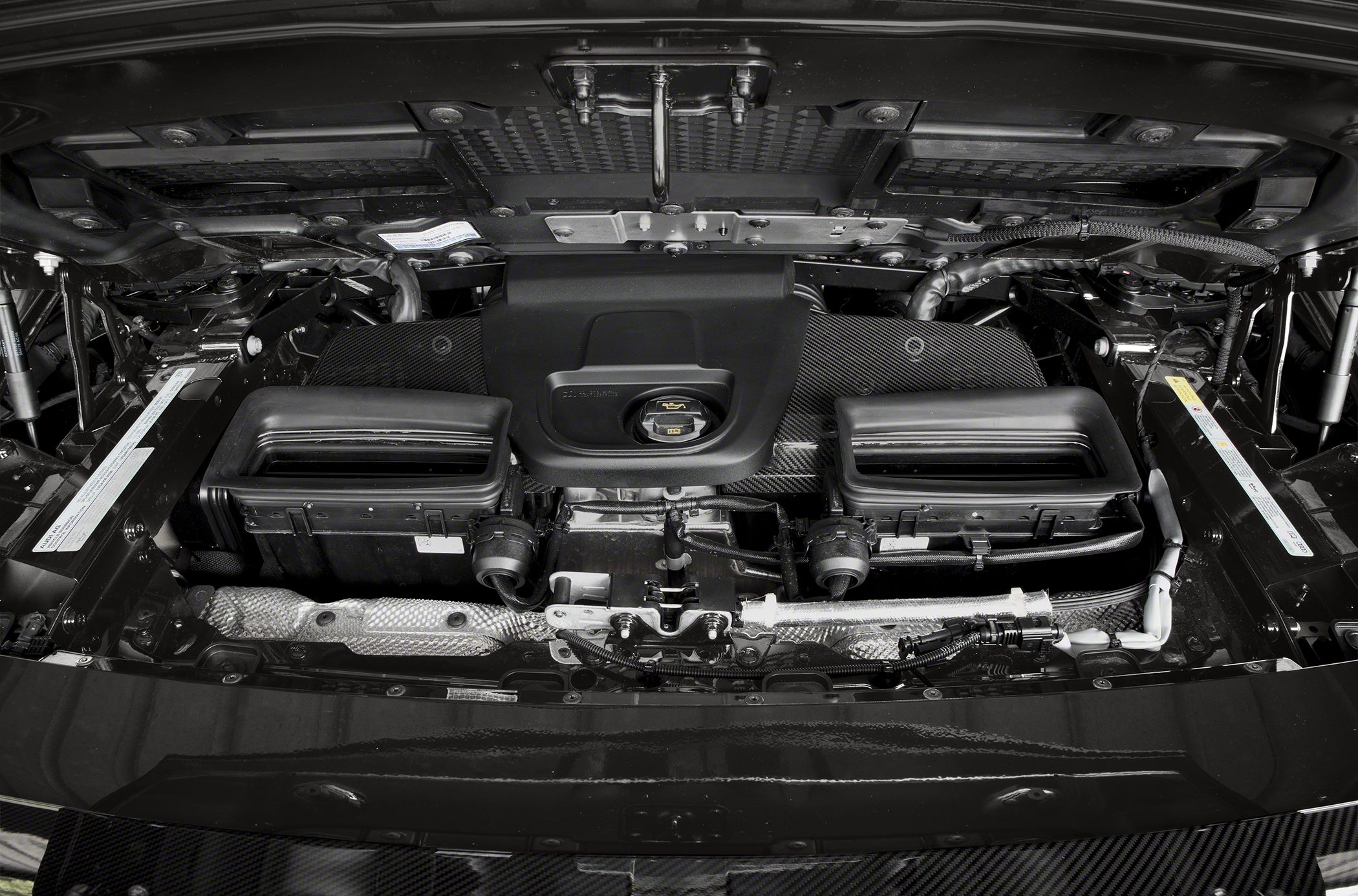 Engine compartment with air intakes and mechanical components