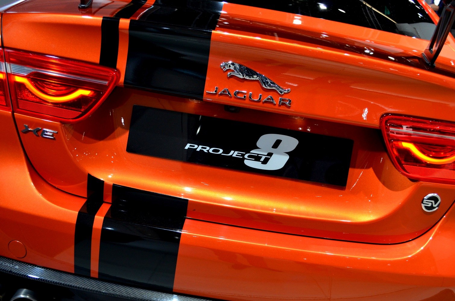Rear view of sporty car with unique tail lights and badges