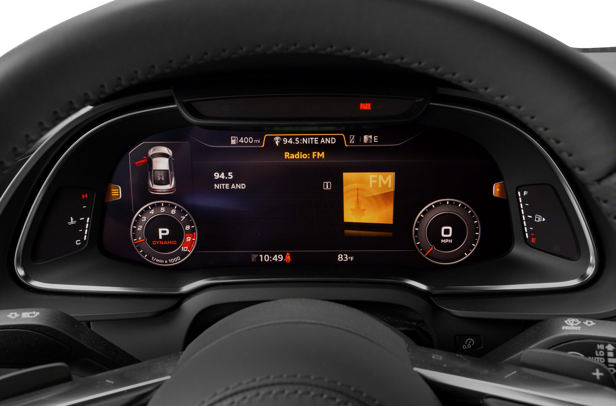 Digital instrument cluster with tachometer, speedometer, and FM radio display