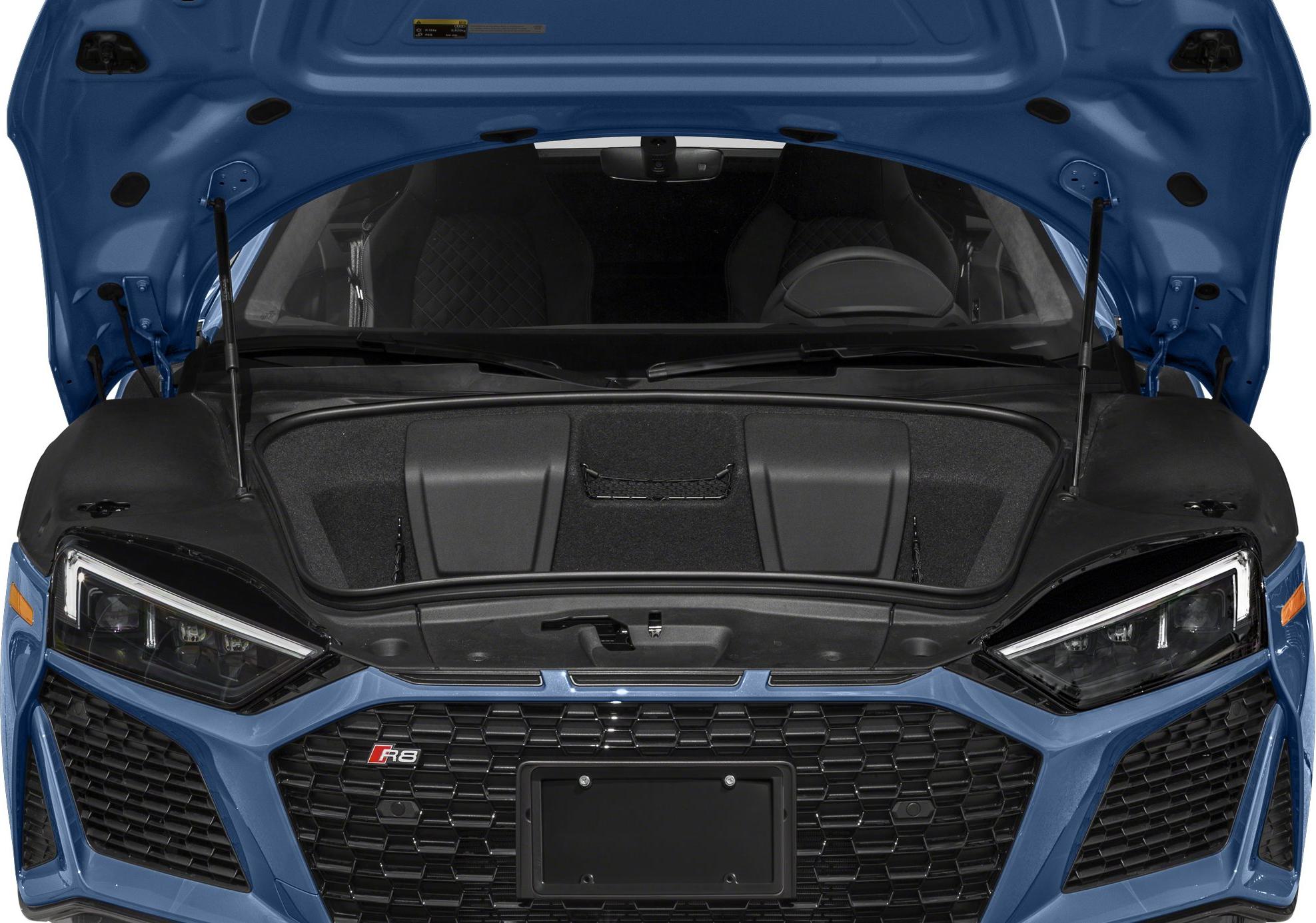 Front trunk storage under open hood with angular headlights