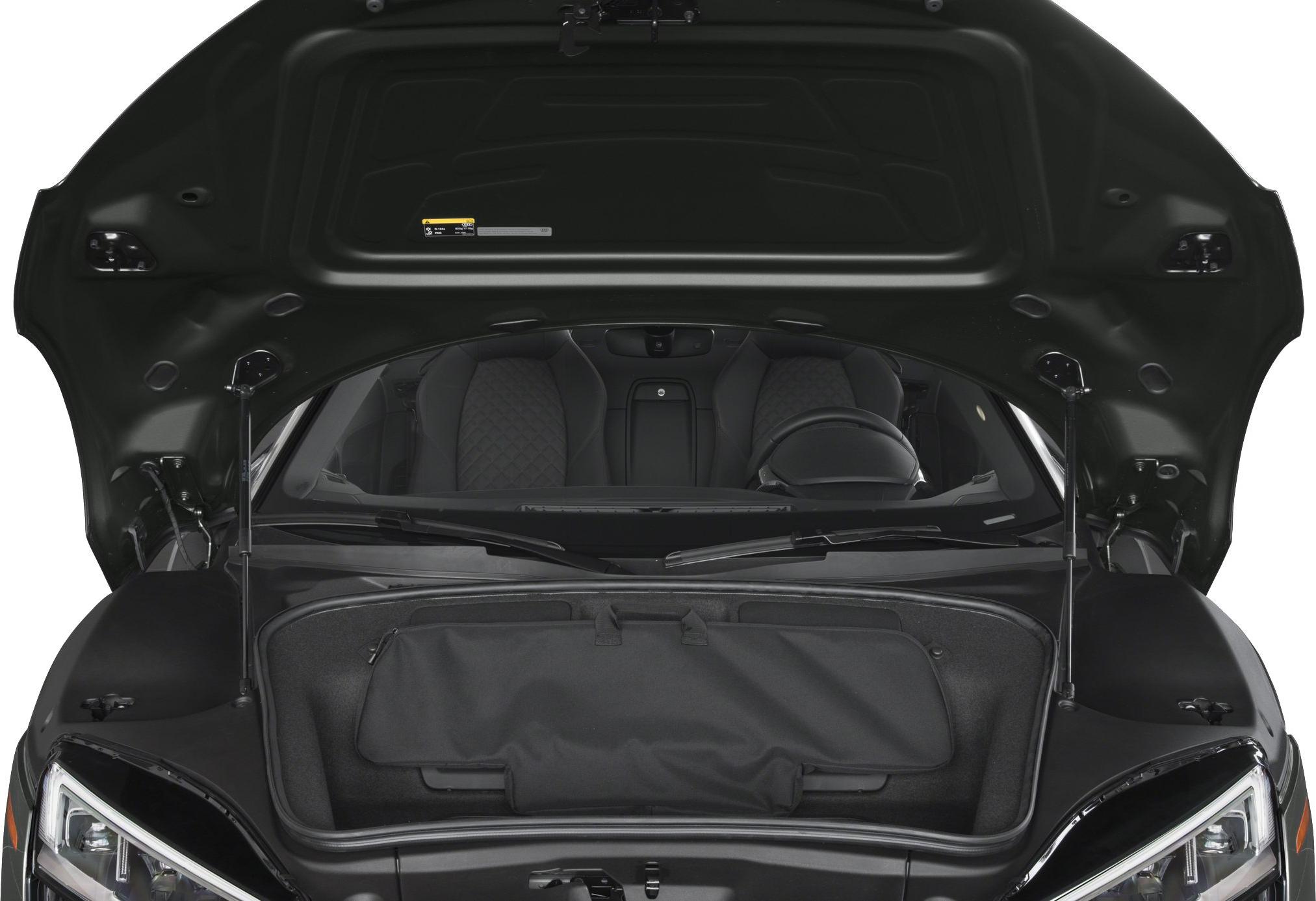 Open front trunk and visible dual sports seats interior