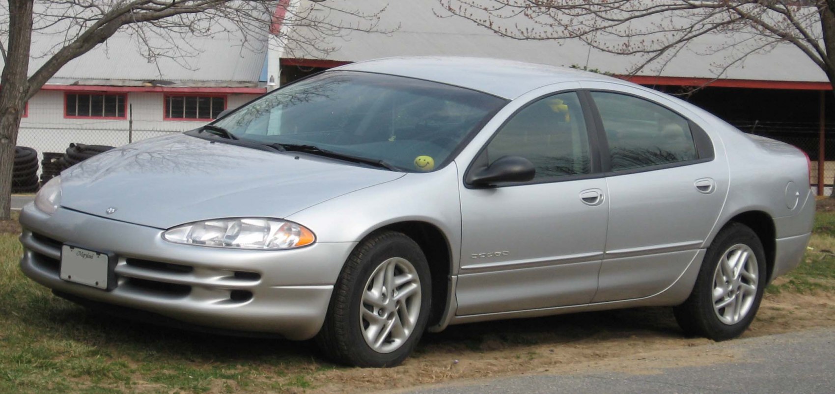 Silver mid-size sedan with rounded headlights and aerodynamic body design