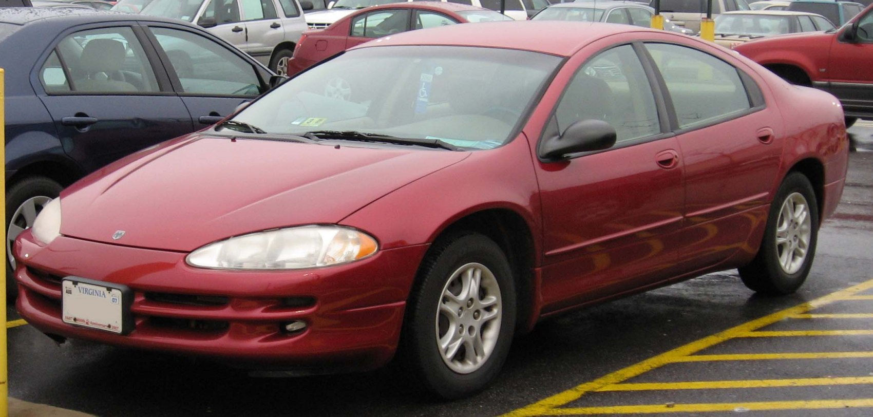 Front corner view with alloy wheels parked in lot