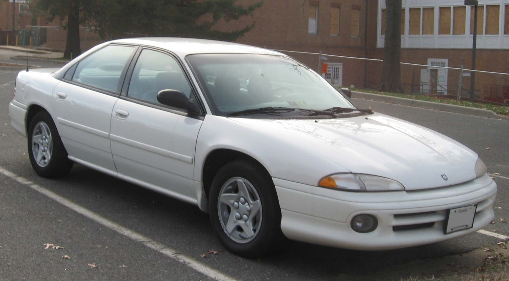 White sedan with aerodynamic design and alloy wheels
