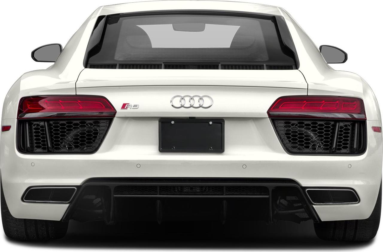 Rear view showing taillights, diffuser, and engine cover of a white sports coupe.