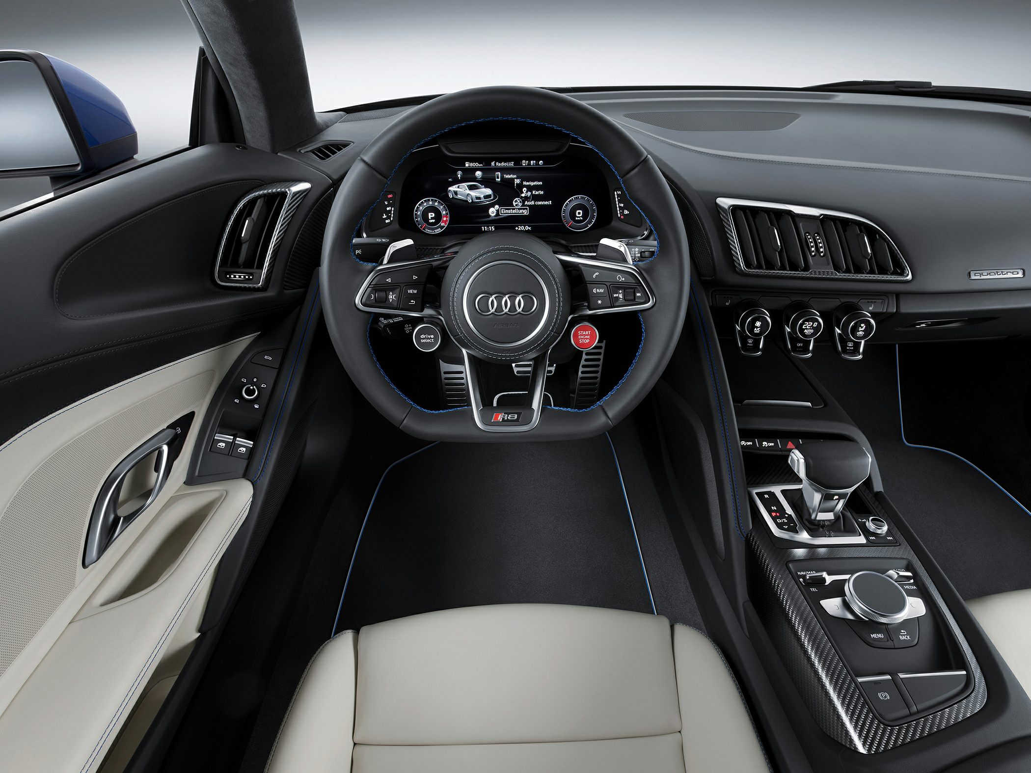 Audi sports car interior with digital dashboard and multifunction steering wheel