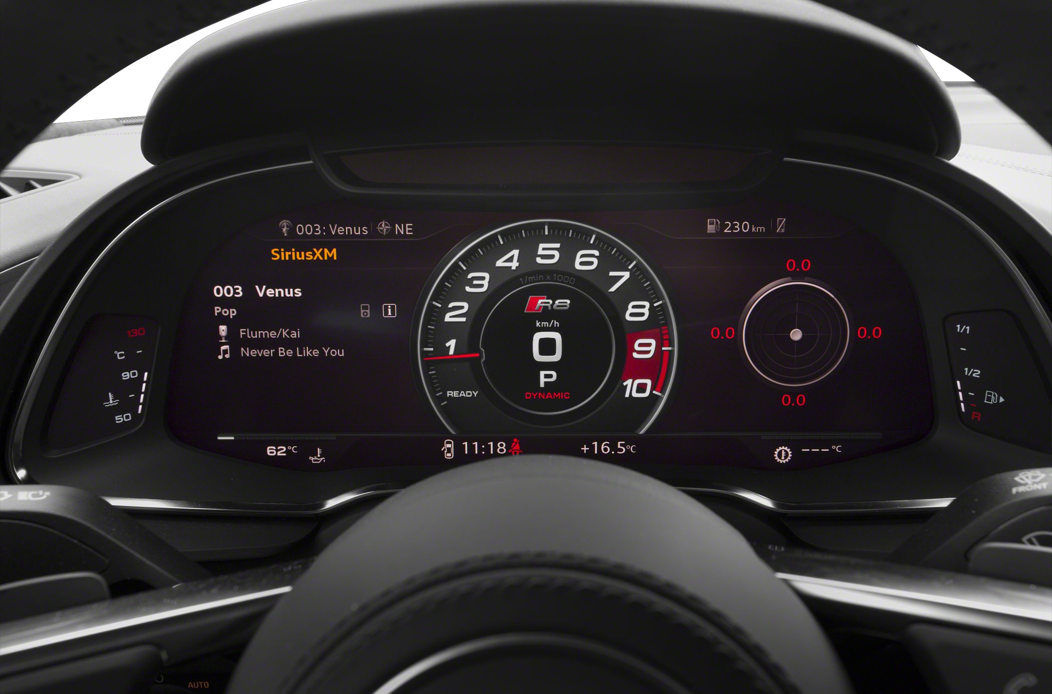 Digital instrument cluster with central tachometer and head-up display