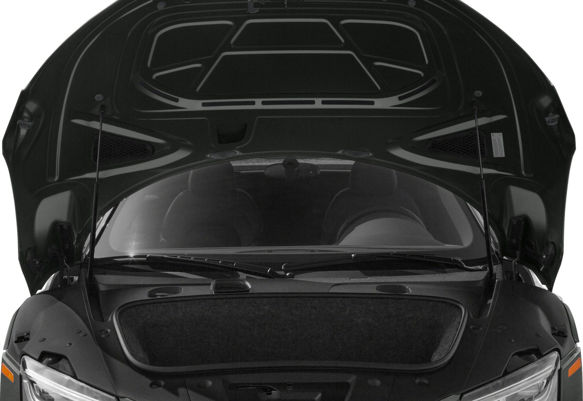Open front trunk with visible headlights and windshield