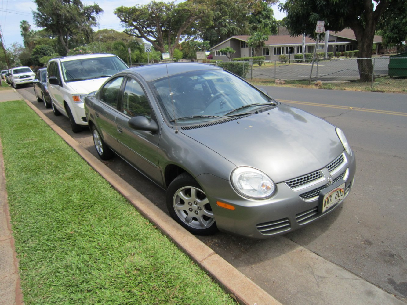Silver 2000 sedan parked on street with rounded headlights