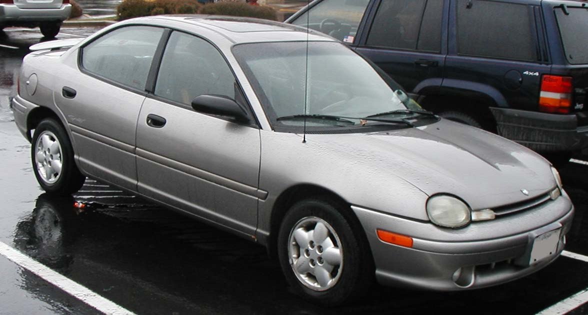 Front-side view of silver compact sedan with rounded headlights
